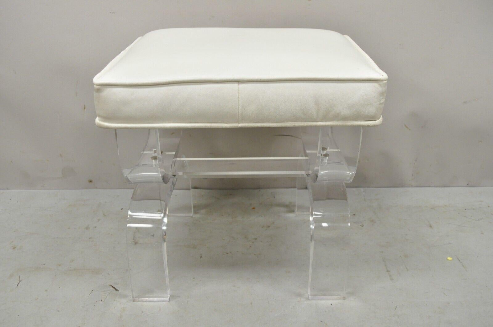 Mid-Century Modern Clear Lucite X-Form Stretcher Base vanity bench. Item features an x-form stretcher base, clear lucite construction, white vinyl seat, clean modernist lines, great style and form. Circa Mid to late 20th Century.
Measurements: 16