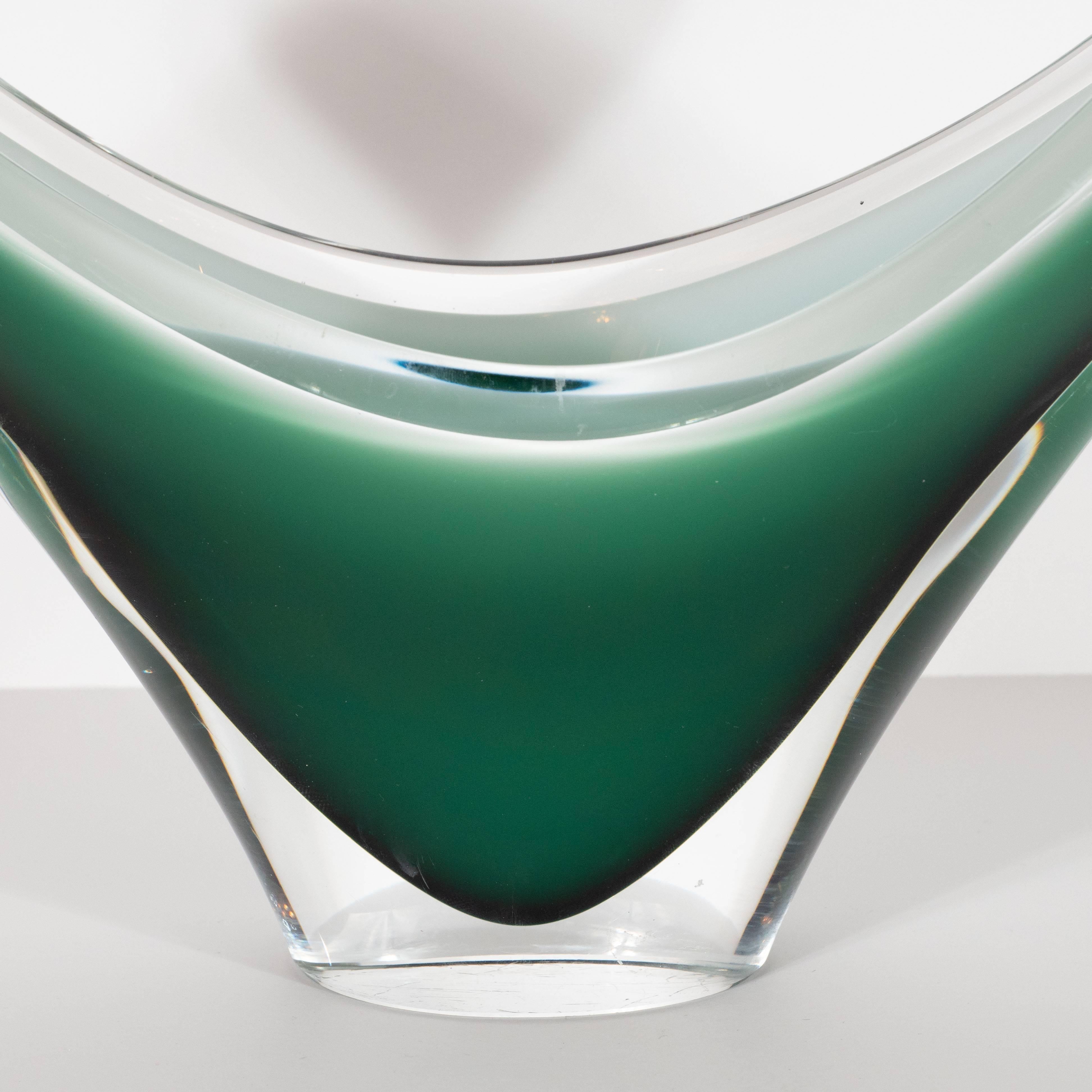 This stunning and sculptural bowl was realized in Murano, Italy- the islands off the coast of Venice renowned for centuries for their superlative glass production, circa 1967. It offers an exuberant form, full of dynamic energy that suggests an