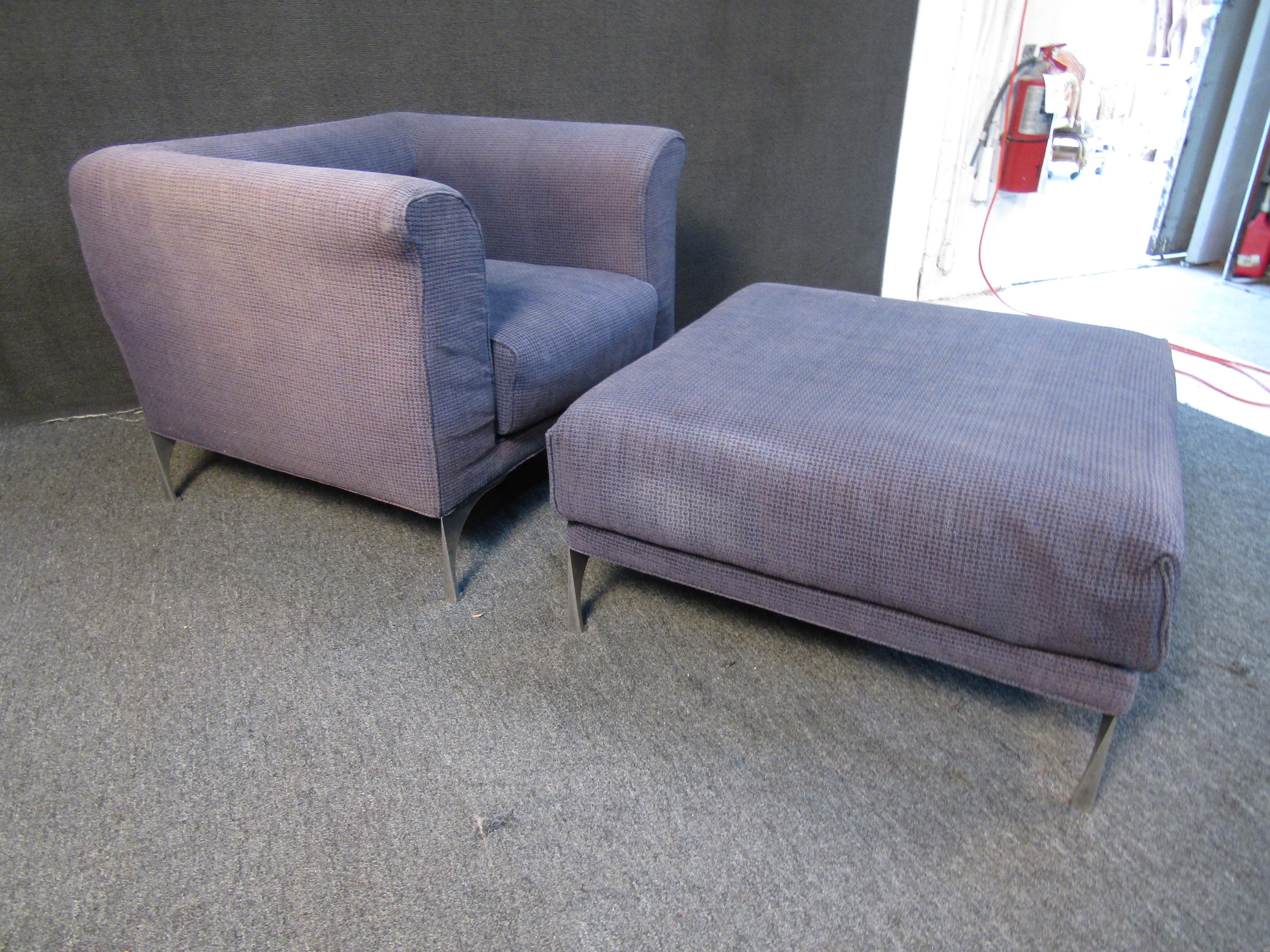 This vintage set by Roche Bobois features an oversized and cushioned club chair, as well as a large ottoman. Durable purple upholstery and metal legs make up the quality materials to complement a unique Mid-Century Modern design. Please confirm item