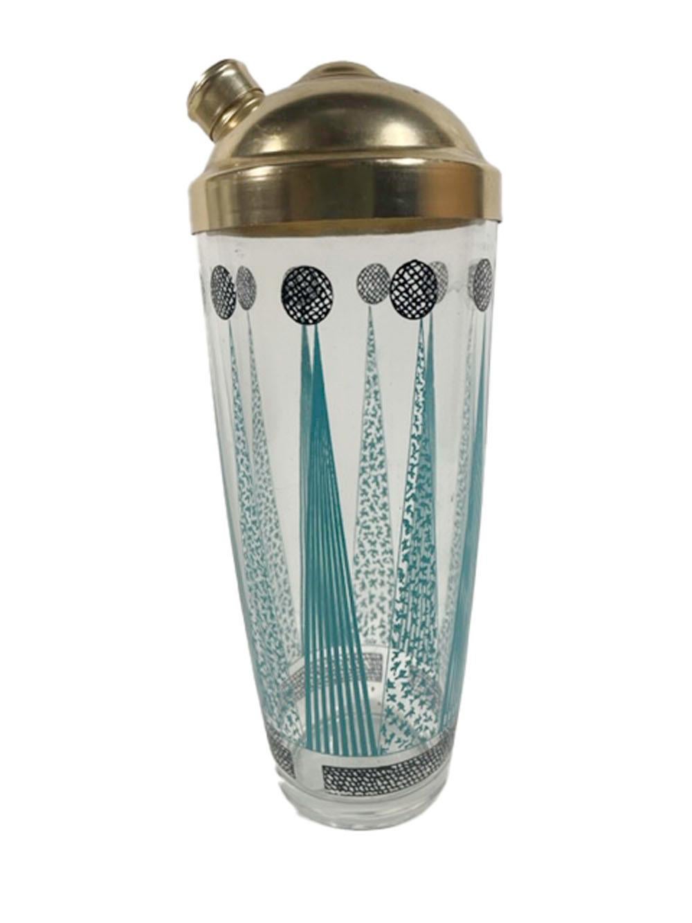 Mid-Century Modern glass cocktail shaker with a gold-toned domed lid and decorated with alternately patterned aqua arrows above a patterned black band and with a patterned black circle on the point of each arrow.