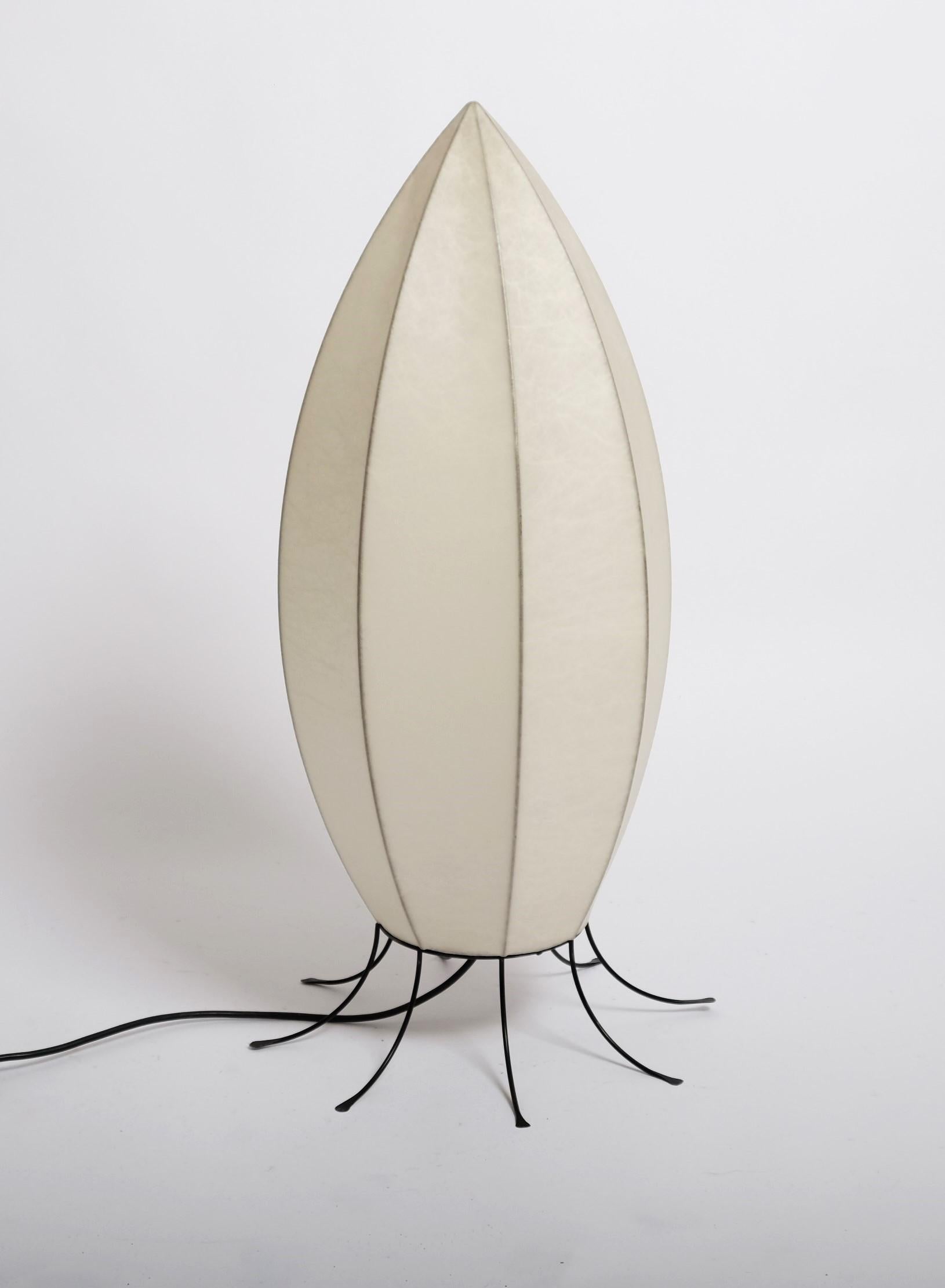 A cocoon floor lamp made in Italy in the 1960s. The floor lamp has been manufactured in the manner of the lamps made by Achille Castiglioni. The lamp shade is of original resin and has the shape of a rocket. 

Very good vintage condition with no