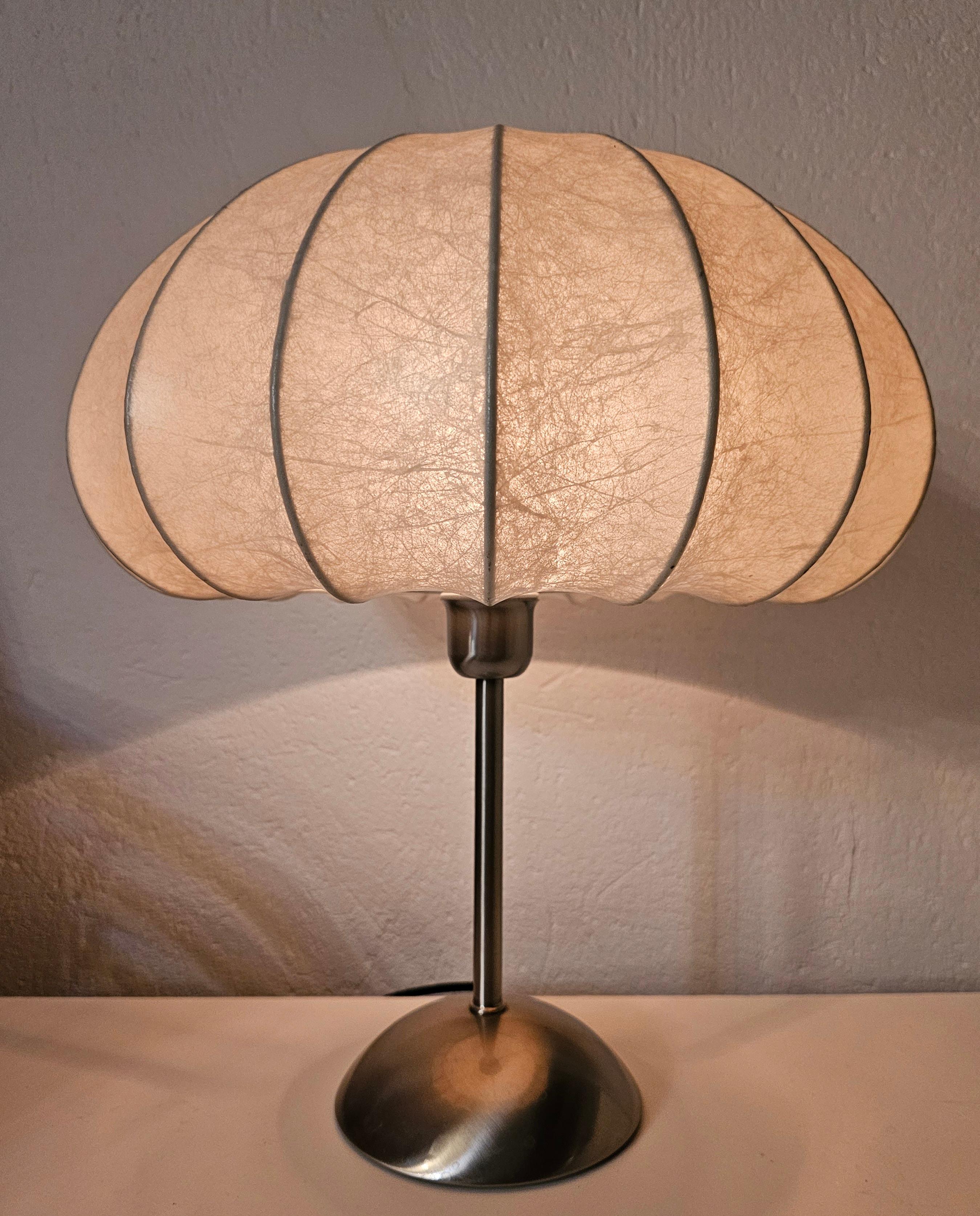 In this listing you will find a beautiful Mid Century Modern Table lamp done in style of Achille Castiglioni. It features a Cocoon shade and the chrome base with touch sensor, allowing you for 3 levels of light intensity. Made in Italy in