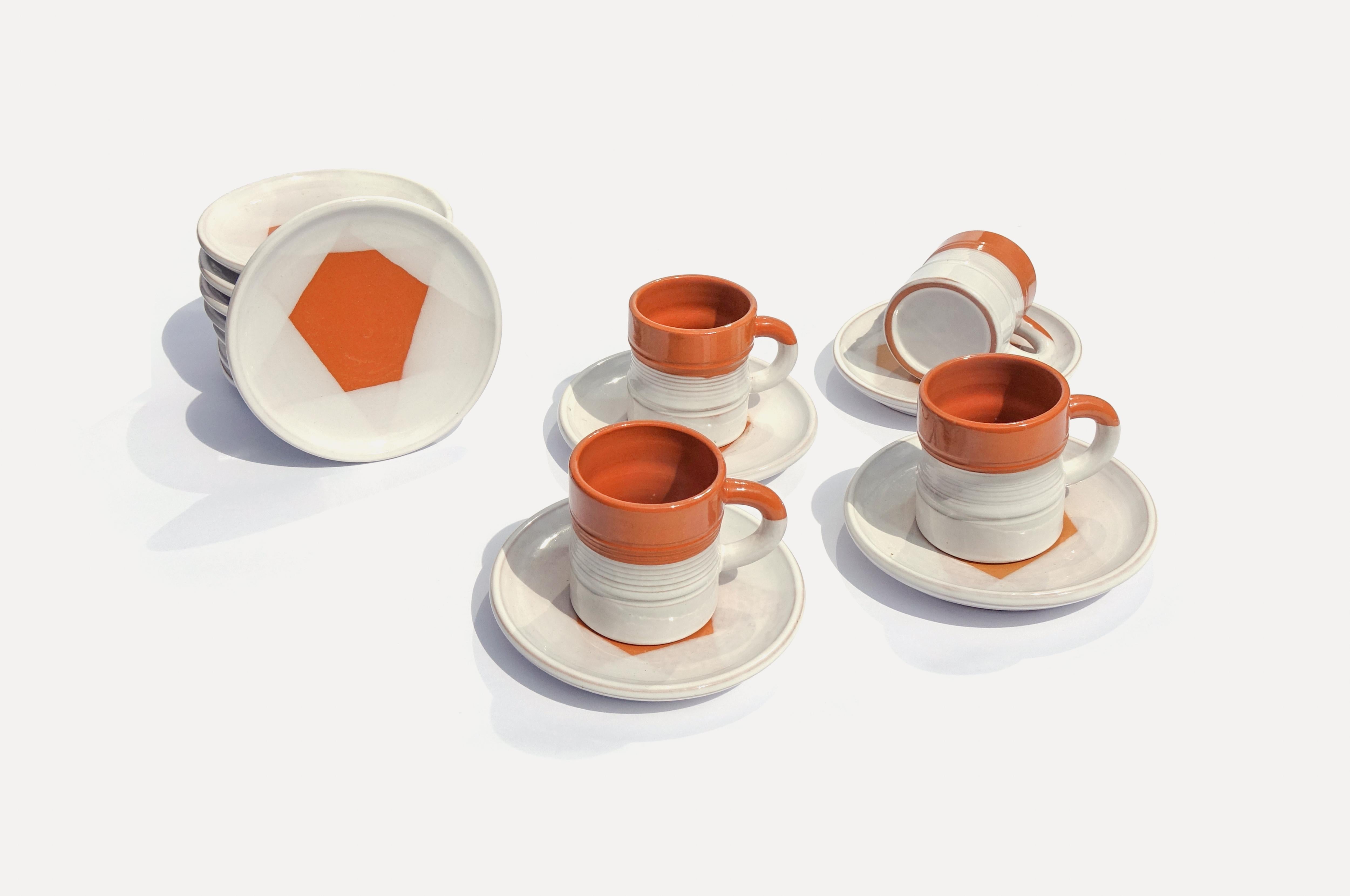 Modernist coffee service from Willy Dougoud's ceramic studio. 23 pieces with 10 coffee cups and saucers, a cream jug, a sugar bowl and a coffee pot. Each piece has a unique glaze and is slightly different. Perfect condition.