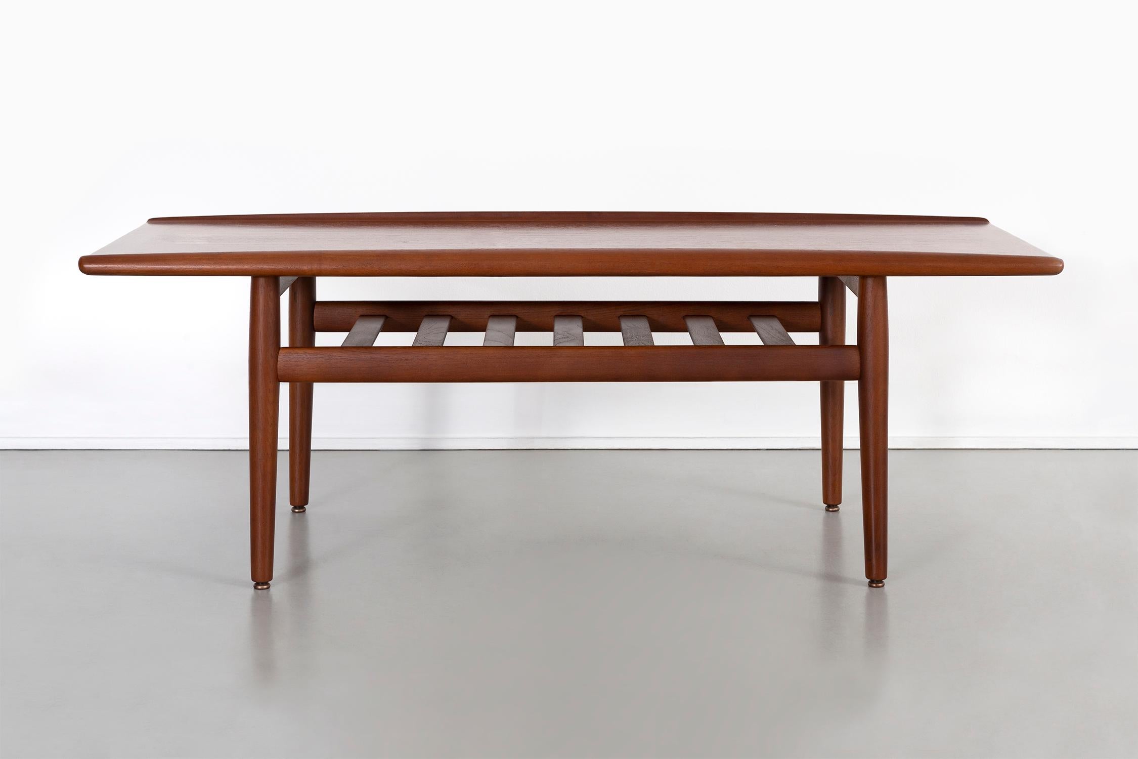 Coffee table

Designed by Grete Jalk

Denmark, circa 1960s

Teak

Measures: 18” H x 51 ?” W x 21 ½” D.