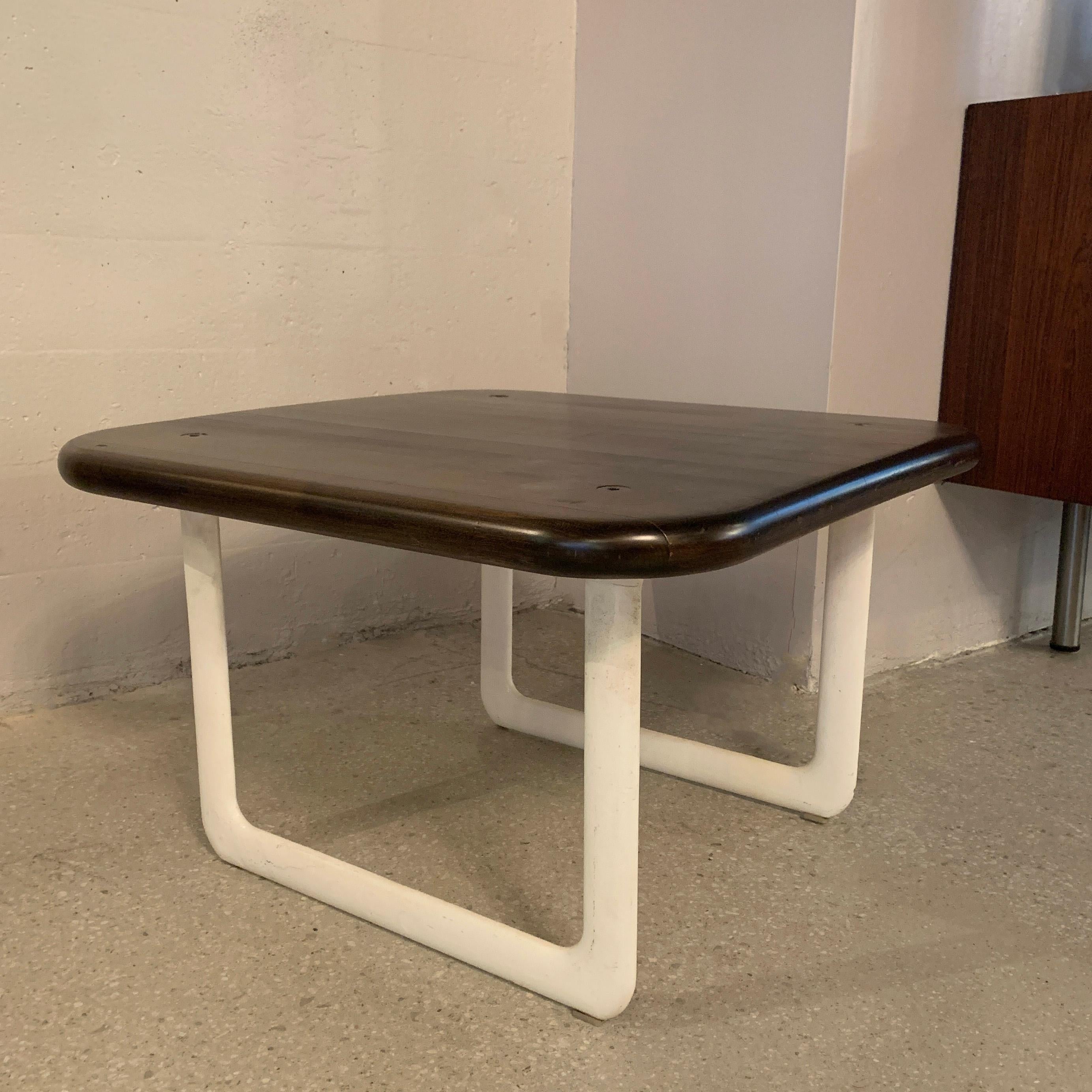 Mid-Century Modern, coffee table by Bruce Hannah & Andrew Morrison for Knoll features white powder coated, cast aluminum sleigh legs with an ebonized maple block top.