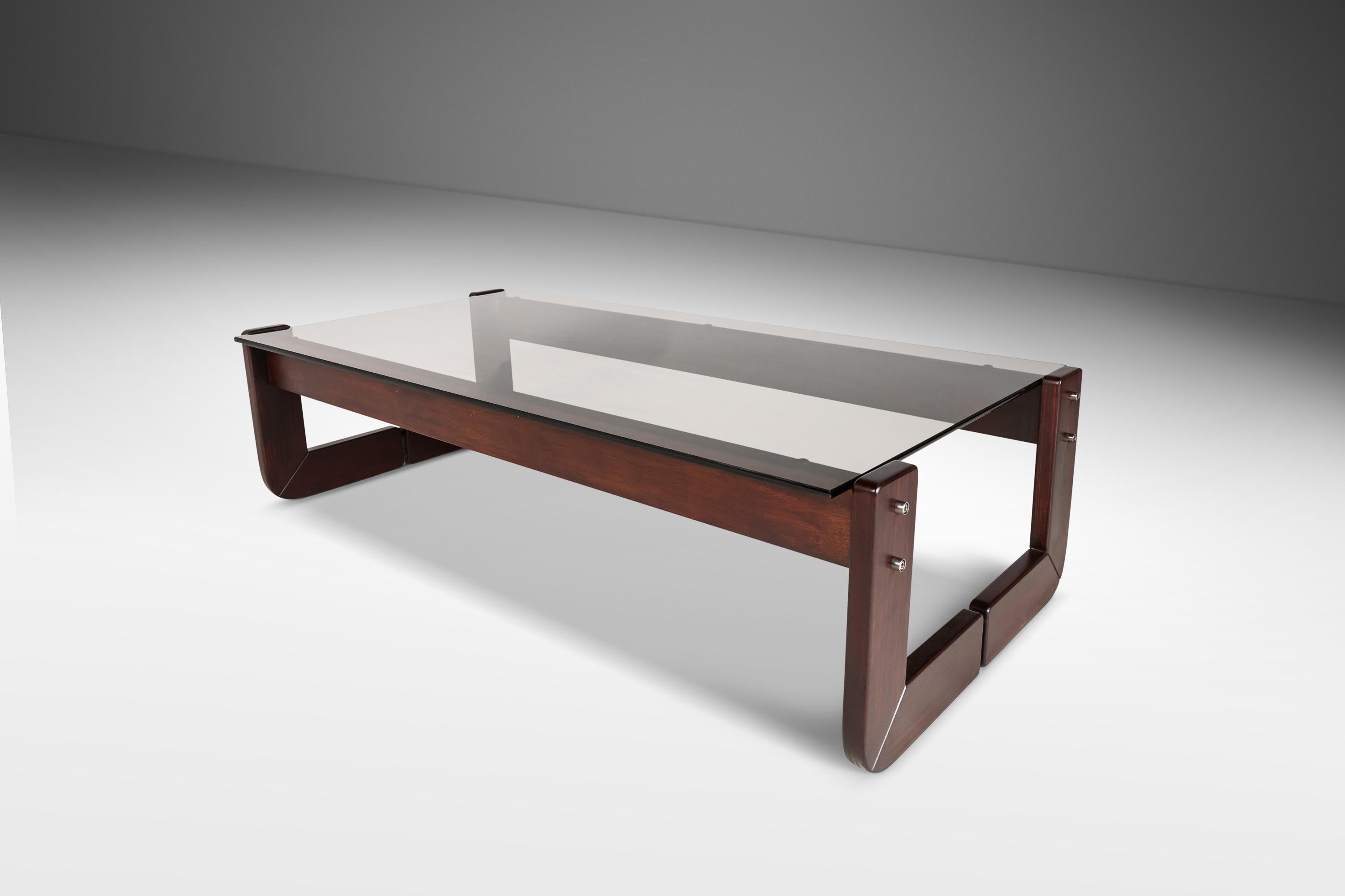 Attention collectors! This alluring coffee table, designed by the incomparable Percival Lafer, is the epitome of Brazilian minimalism for which Lafer and his furniture company are regarded as the paramount makers. The solid jacaranda frame is in
