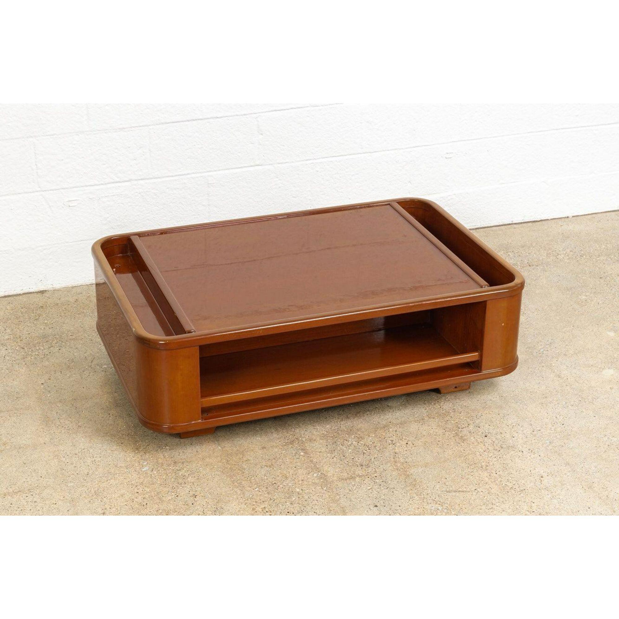 This vintage midcentury Italian coffee table circa 1970 has fabulous mod style. The Minimalist design features a low profile with clean geometric lines and rounded edges. It is very well constructed from solid wood with a glossy lacquered enamel