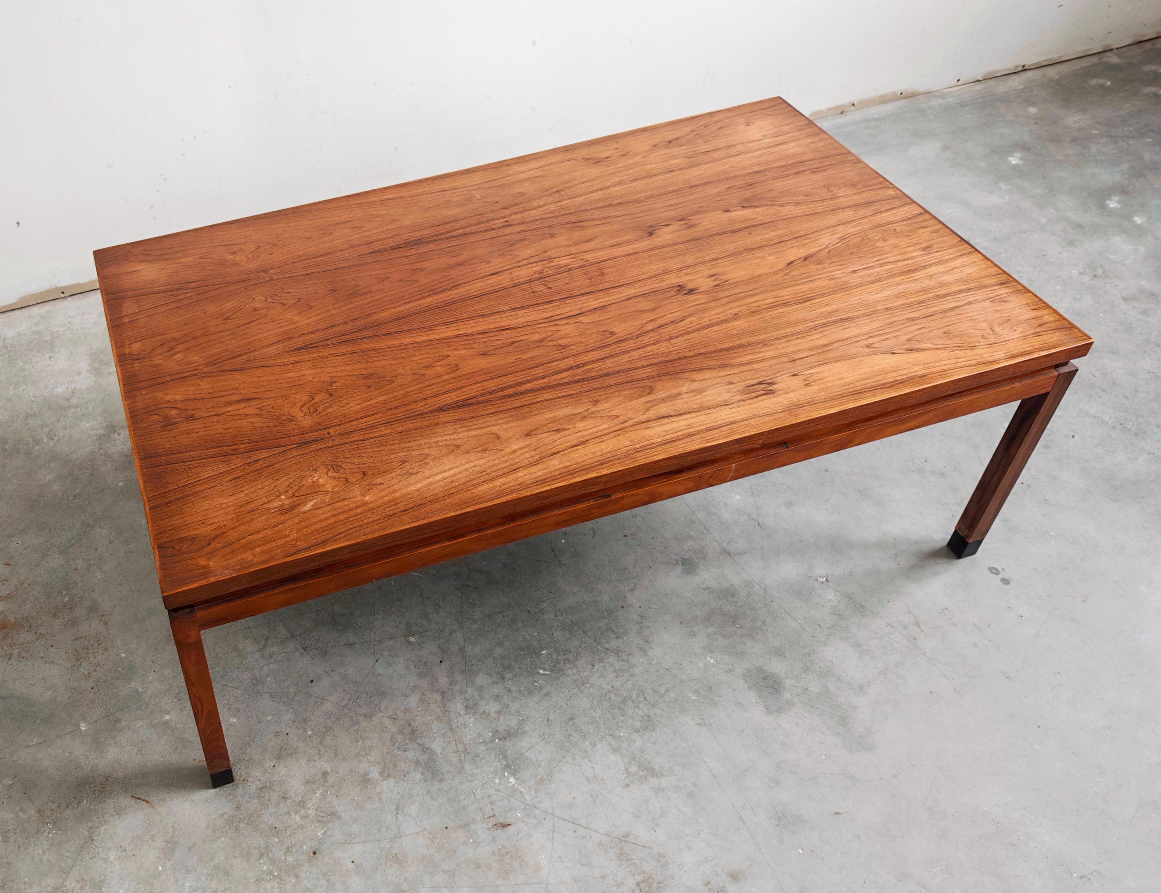 In this listing you will find a rare Mid Century Modern Coffee Table done in teak, design attributed to Finn Juhl. It features sleek and warm design which could easily fit with a variety of interiors. Made in Denmark in the 1960s.

The table is in a