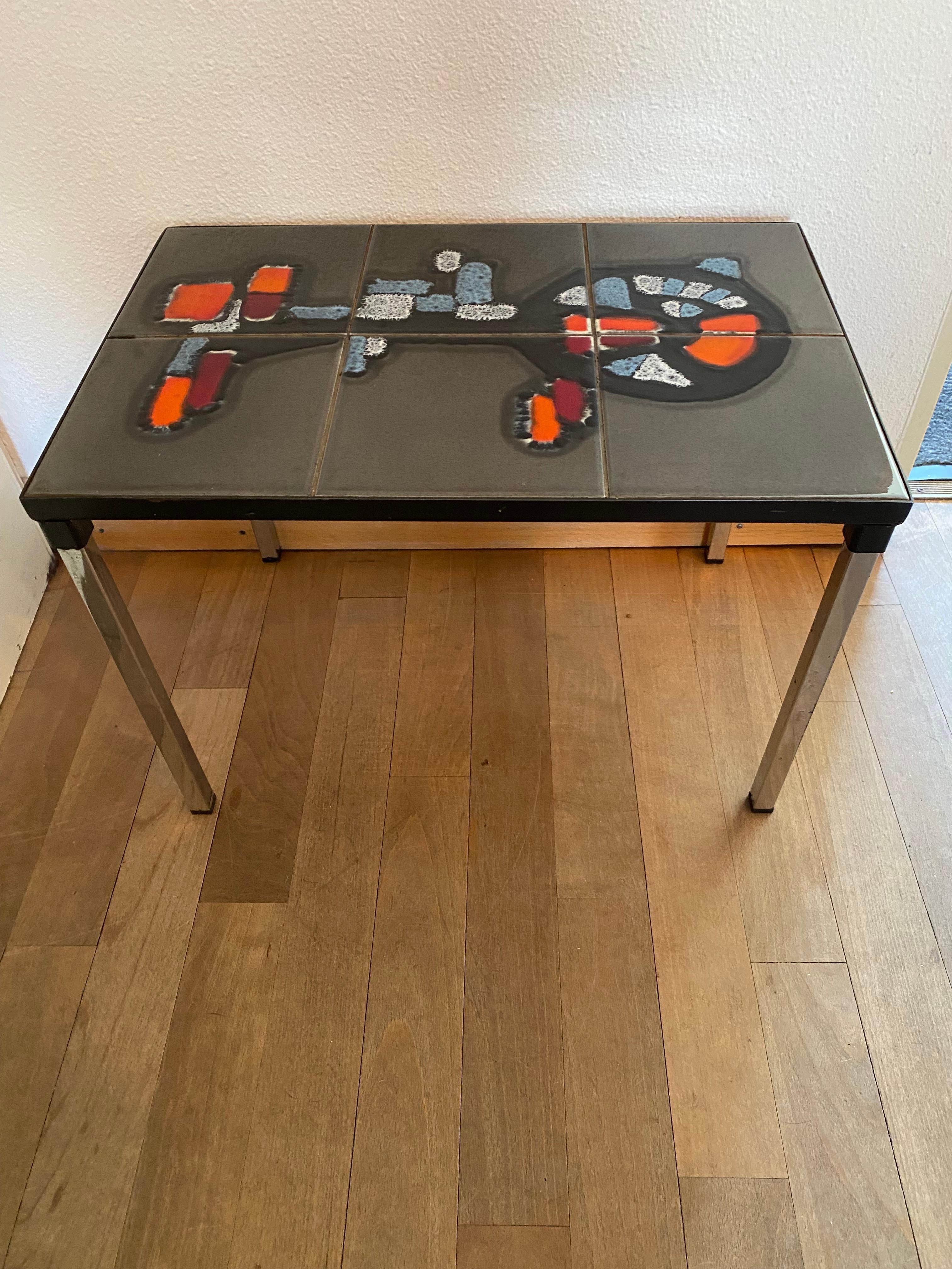 Just a very nice coffee table from the Mid-Century period. Tiles are in a very good condition, no cracks or whatsoever.
In the style of Belarti.