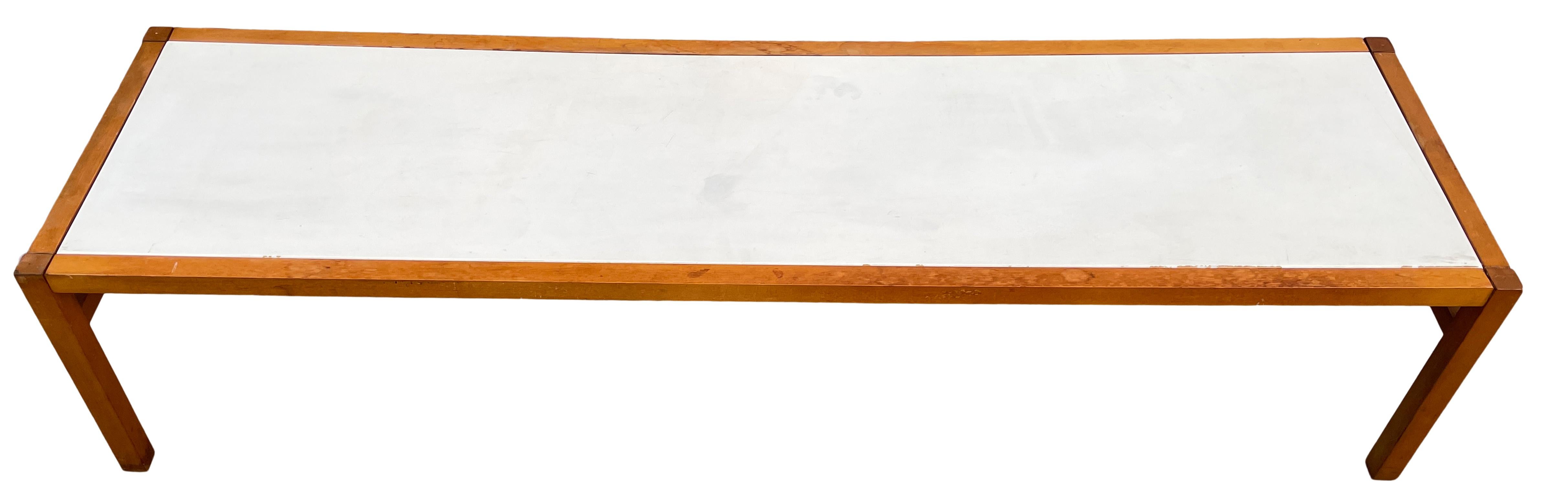 Mid Century Modern coffee table with white top Style of Paul Mccobb. Two Matching coffee tables available - Listed as Individual items. Solid wood frame and white Lacquer insert. No Labels or Marks.