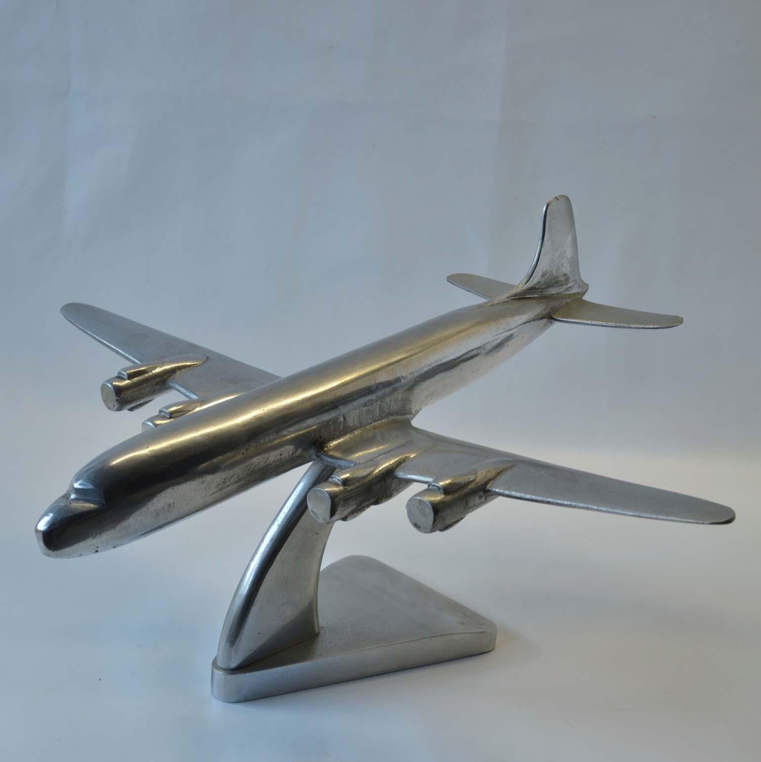 Group of Mid-Century Modern aluminum and chrome airplane models, 1960's-1970's. These decorative sculptures display well cupboard, credenza or a desk.

1) large jet airplane is made of cast aluminum
Dimensions: 49-45-height 25 cm
2) medium jet