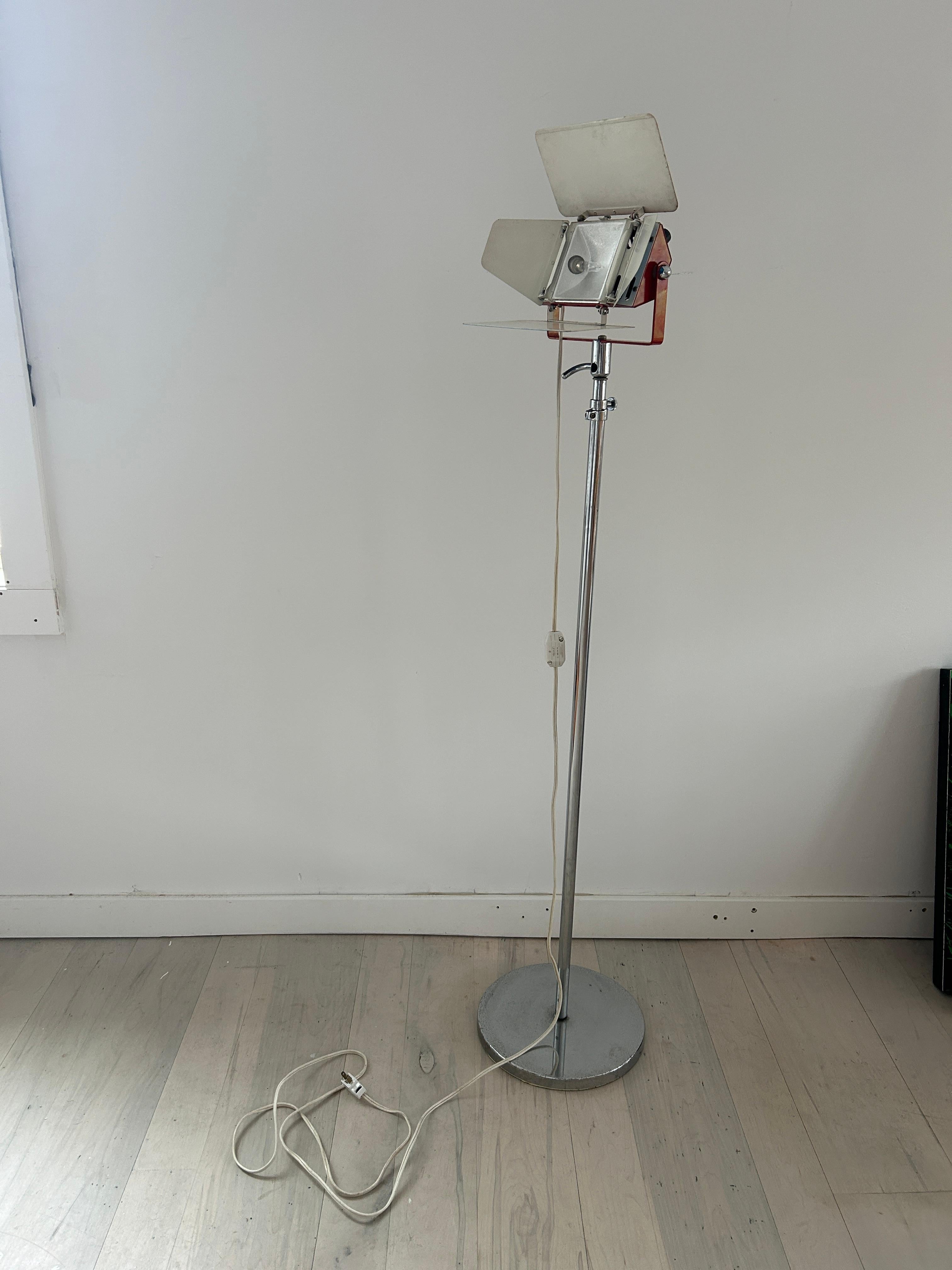 Mid-Century Modern Colortran midcentury chrome floor lamp. Film style floor lamp circa 1980. Blue and red lamp with chrome base. Light has adjustable barn doors which angle the light. Halogen bulb 120v - American plug. Has dimmer in cord - ready for