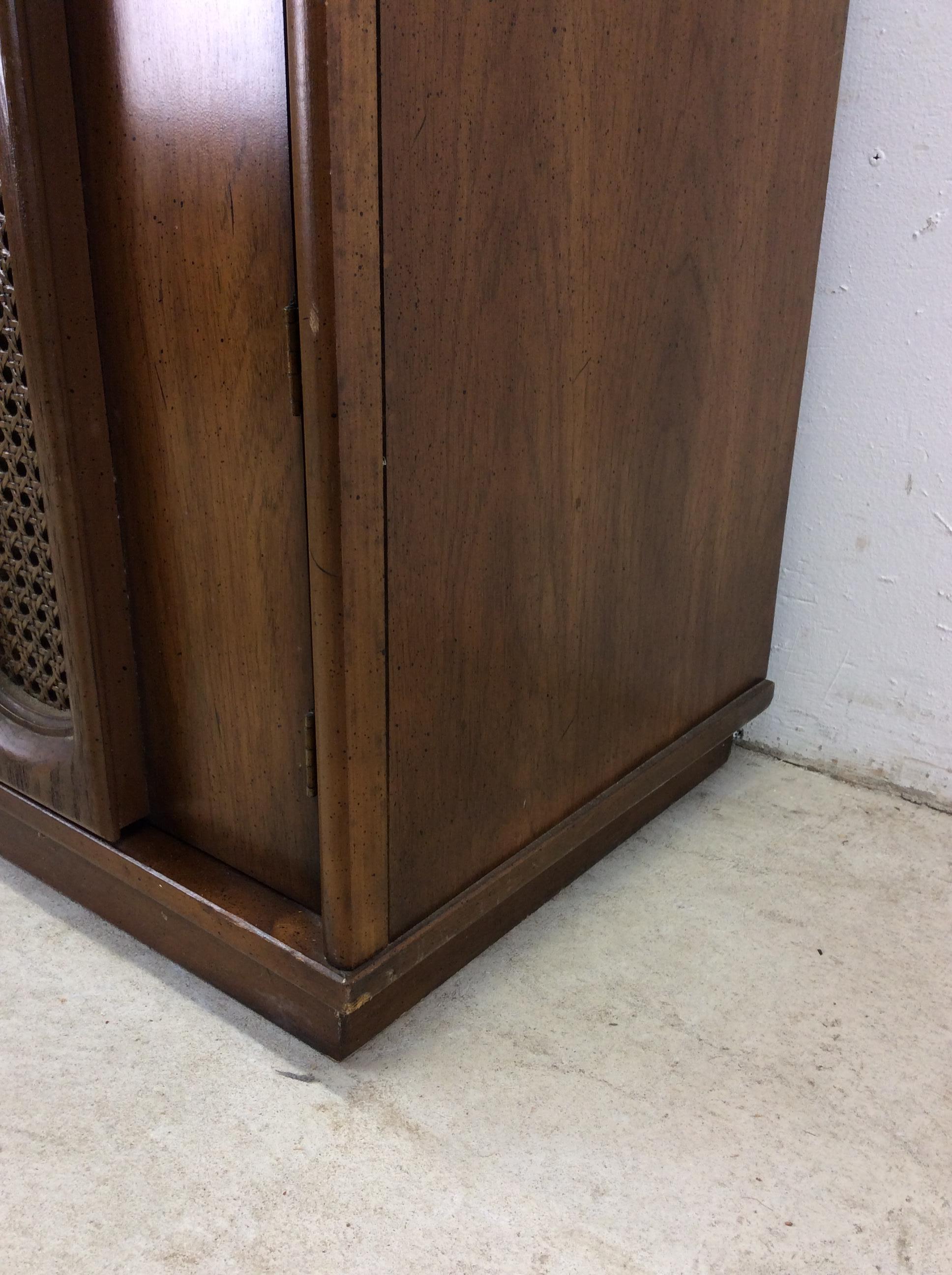 Cane Mid century modern compact China cabinet with cane doors For Sale