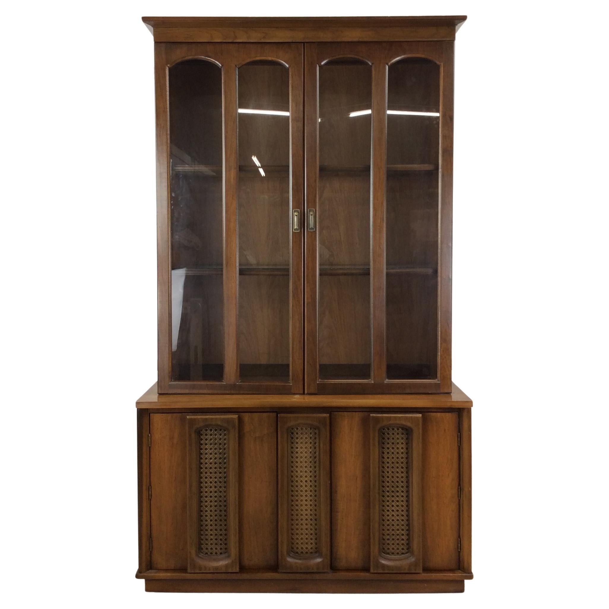 Mid century modern compact China cabinet with cane doors For Sale