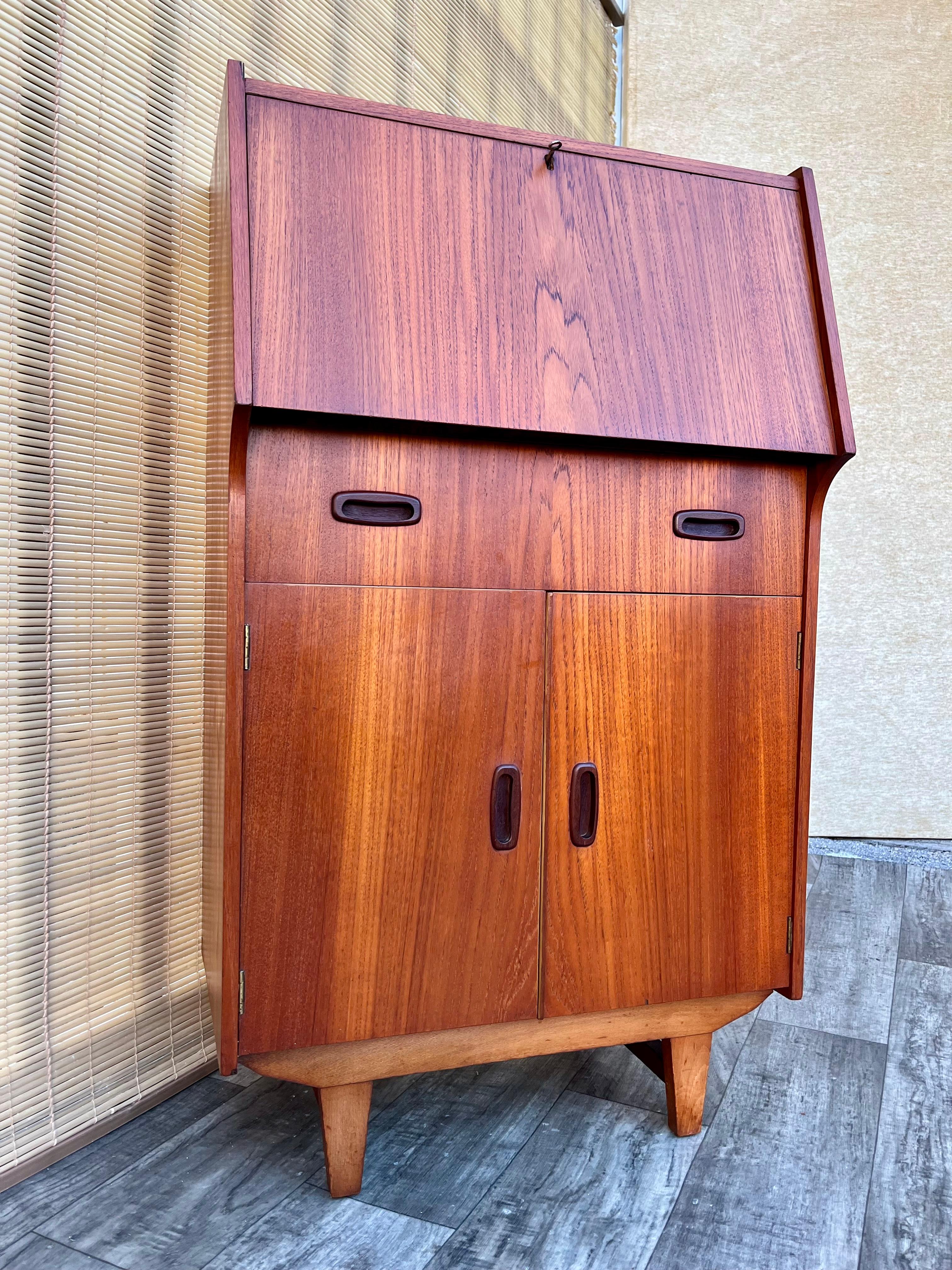 Wood Mid Century Modern Compact Drop Down Secretary Desk . Circa 1960s For Sale