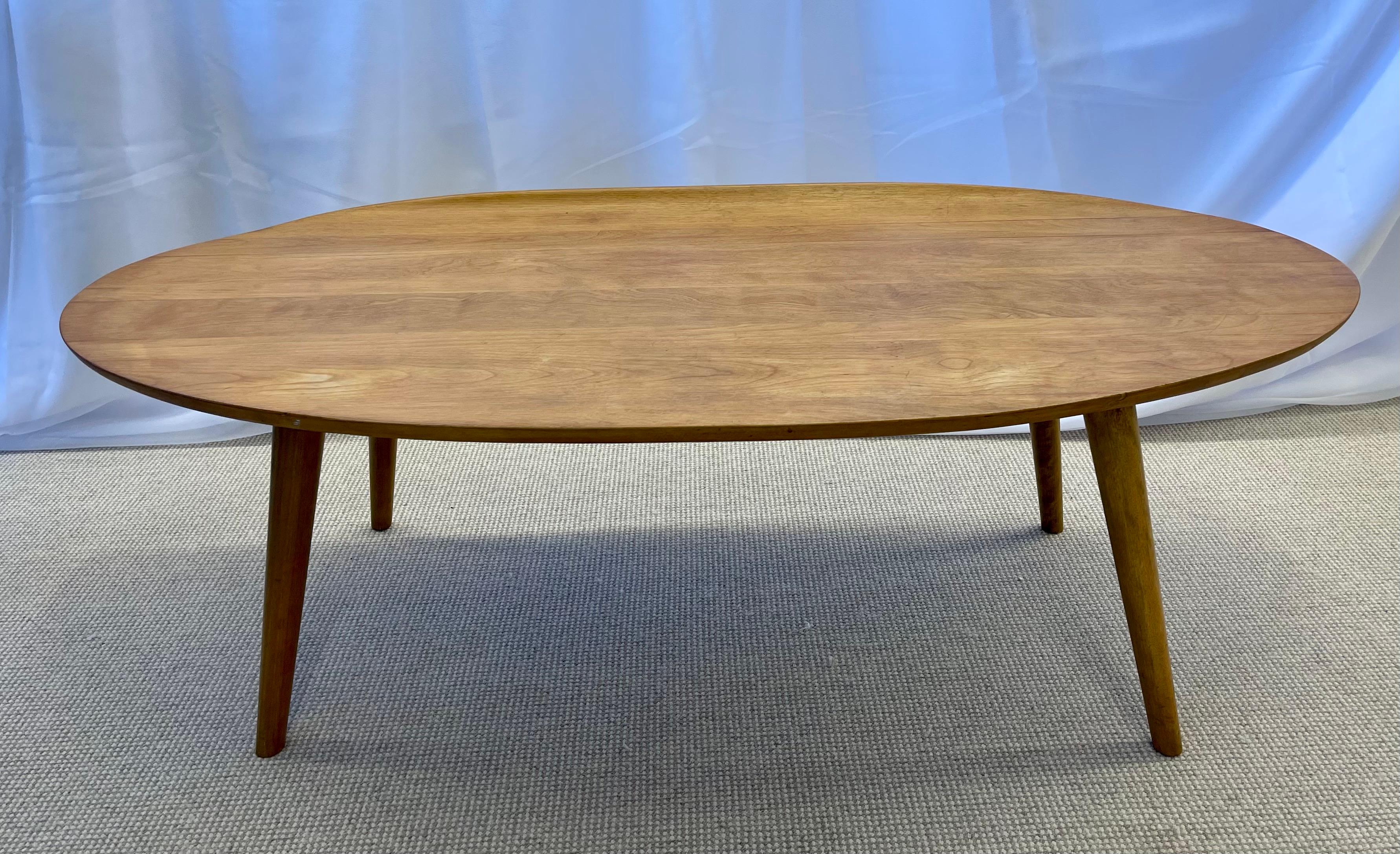 Mid-Century Modern Conant ball coffee table designed by Russel Wright. The Elliptical Coffee Table With Curled Edge is a sleek and stylish example of this designers work in a grained maple. USA, c. 1955 Impressed manufacturer's mark to underside