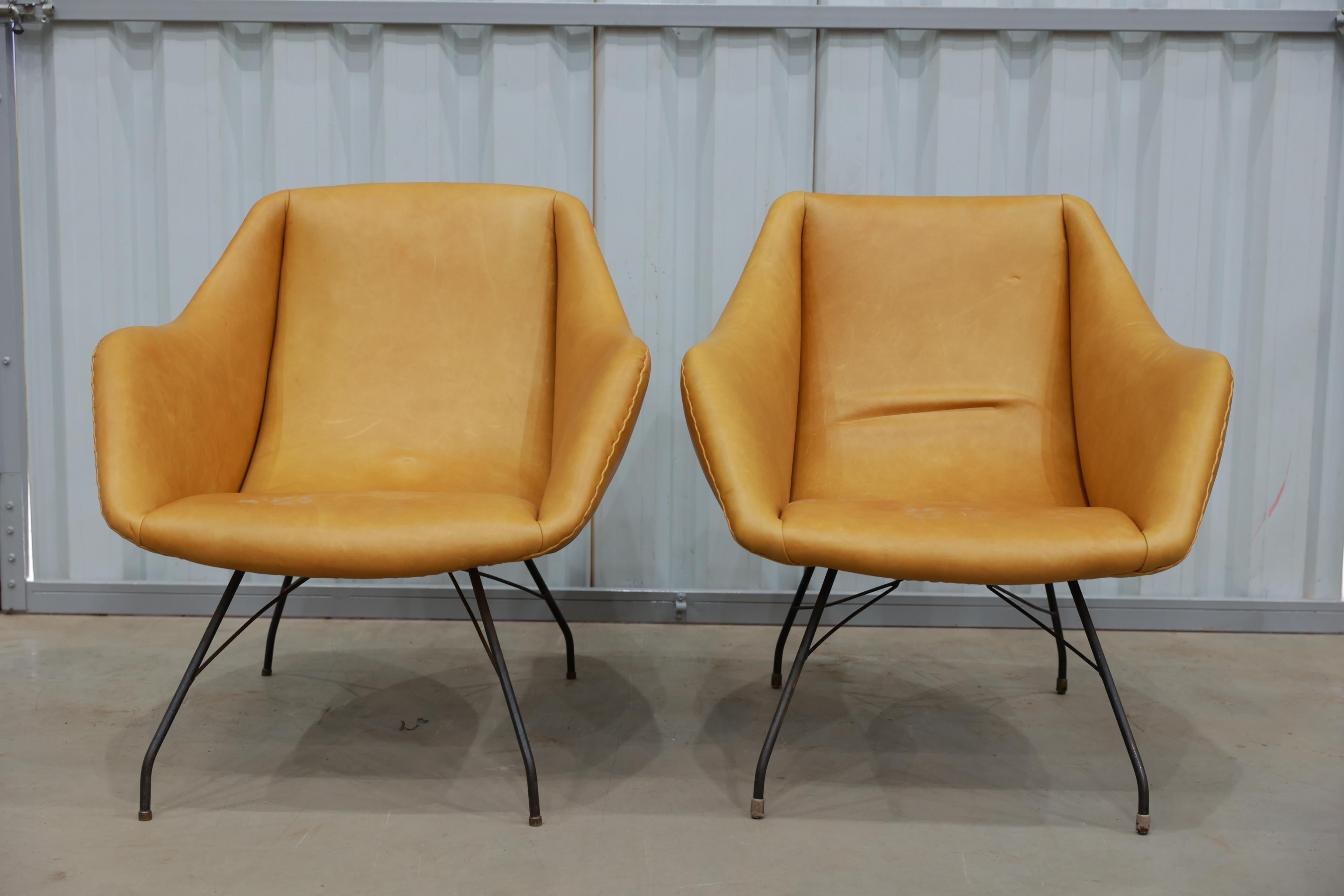 Available today, with domestic shipping in NYC metro area included, this Mid Century Modern Pair of Concha Armchairs in Leather & Metal by Carlo Hauner, c. 1950 is nothing less than gorgeous!  

This pair of Brazilian modern armchairs, designed by