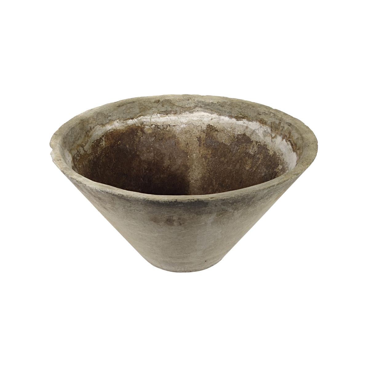 Large planter designed by famous Swiss artist, designer and architect Willy Guhl. The planter has a conical shape. With its beautiful patina it will make a great statement on your rooftop, patio or living room.
The planter has 5 holes on the bottom