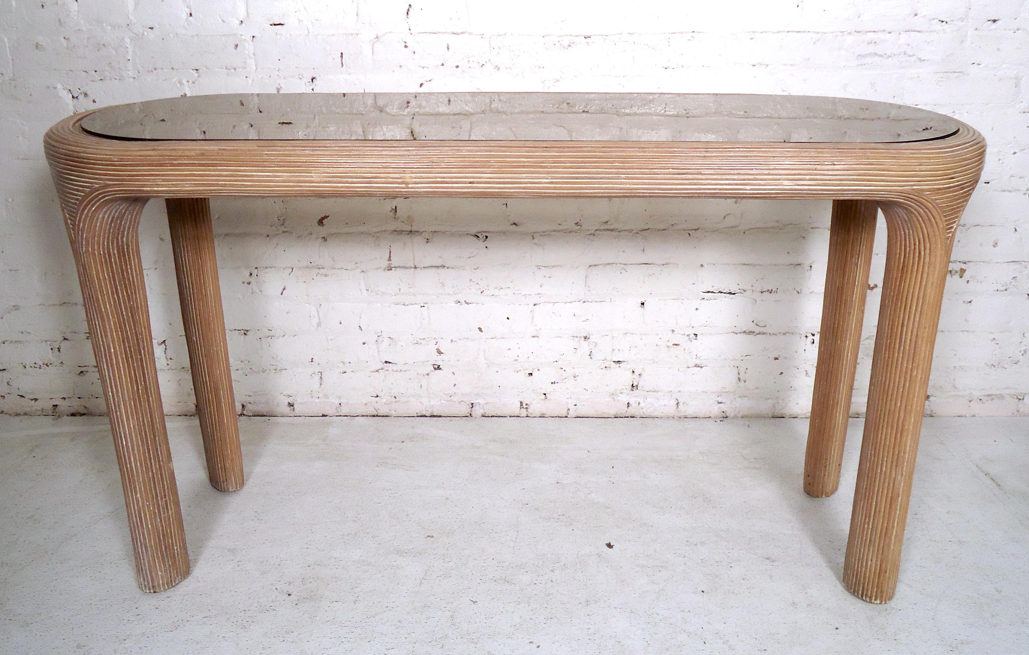 Sculpted vintage modern console table features a smoked glass top and sturdy wood frame.

(Please confirm item location - NY or NJ - with dealer).