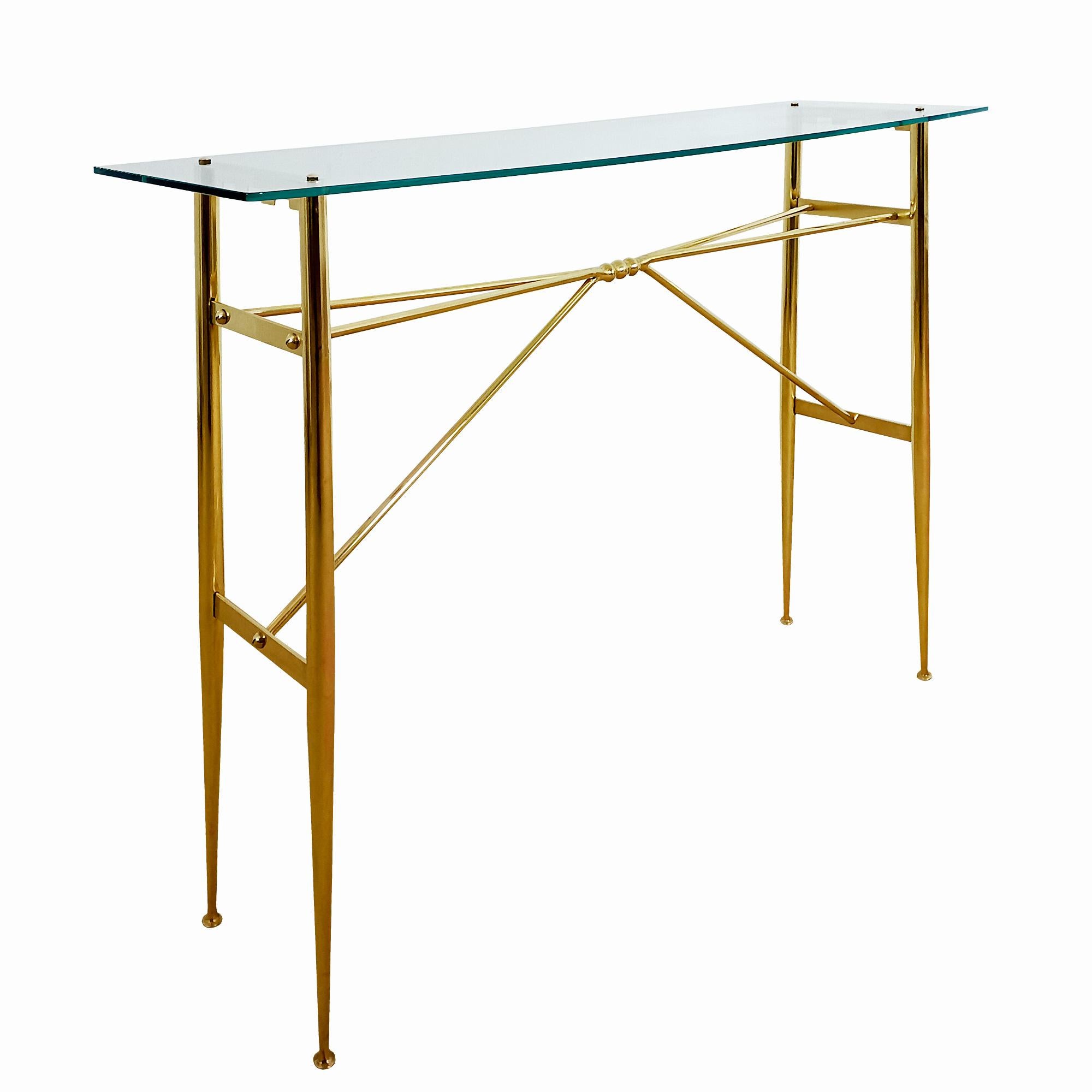Console with solid polished brass strut and glass shelf. Completely removable. Great manufacturing quality.
Italy circa 1950.