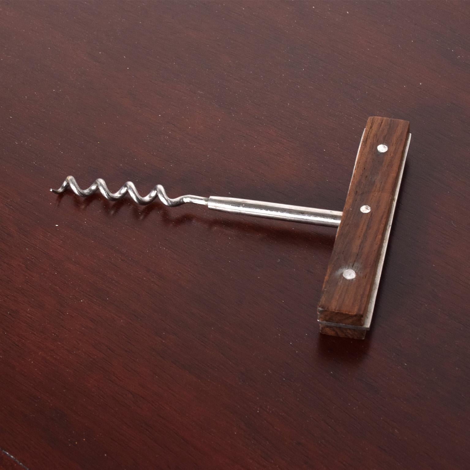 For your consideration a vintage Mid-Century Modern cork opener. 
Stainless steel with rosewood handles. Stamped 
