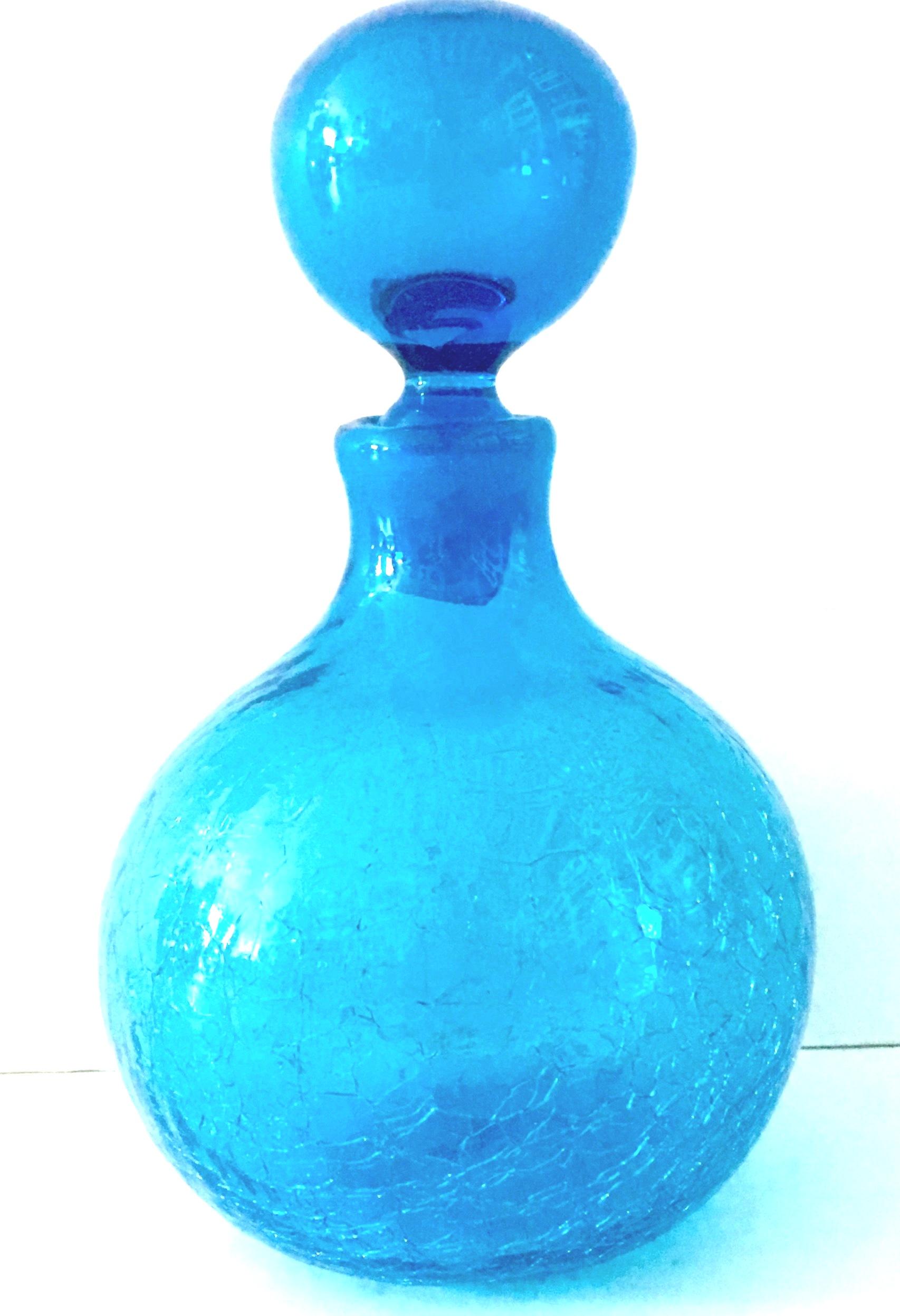 Mid-20th Century Modern Blown Crackle Glass Bulbous Liquor Decanter By, Blenko. Classic, iconic and timeless this Blenko Glass Liquor Decanter features a bulbous shape in vivid blue 