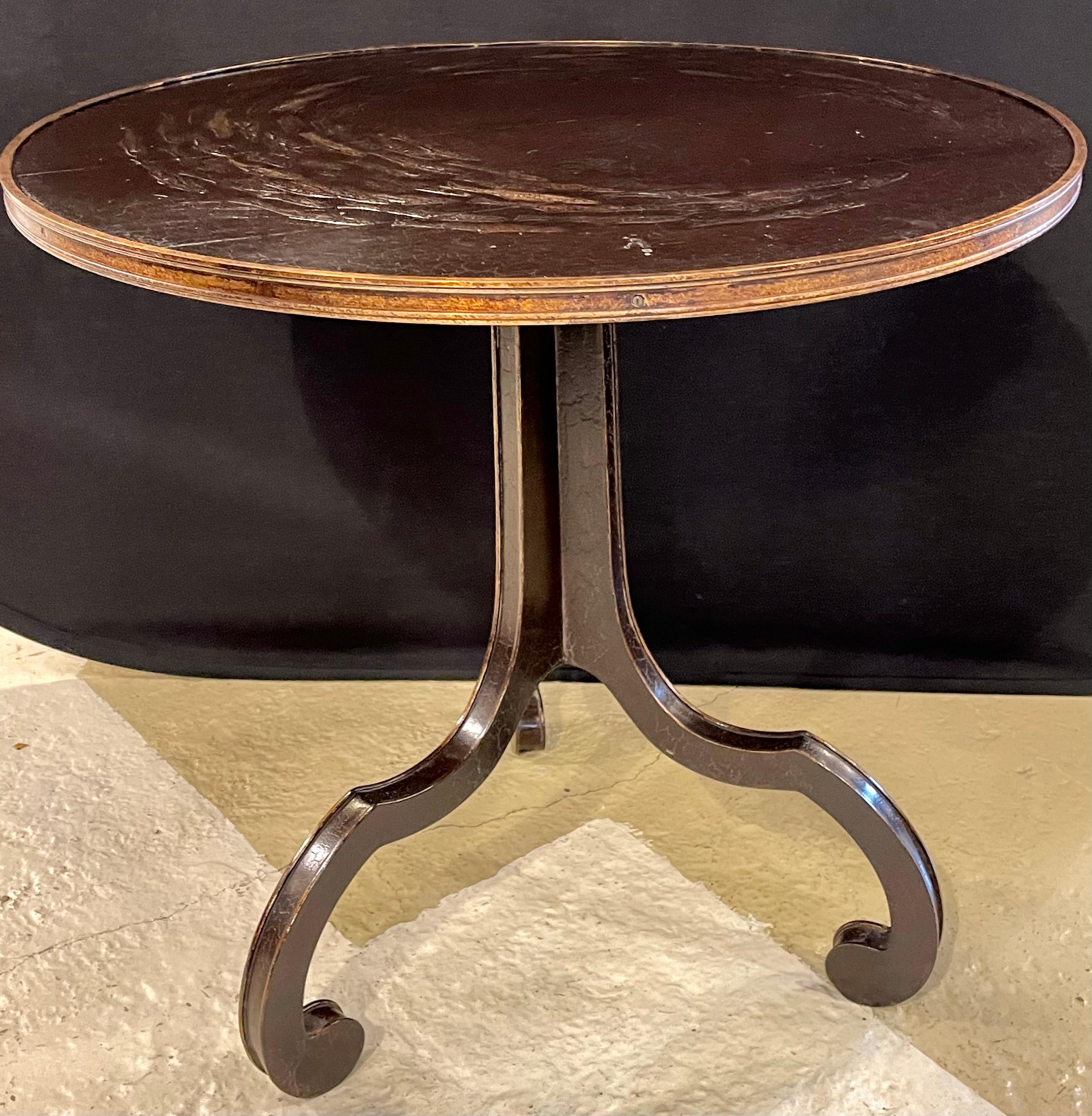 Rose Tarlow Melrose House La Mer Centre Table The top depicting a school of fish. This sleek and stylish center, end or lamp table has a tripod crackle ware and parcel-gilt bordered base supporting a gilt framed tabletop. The top having a large
