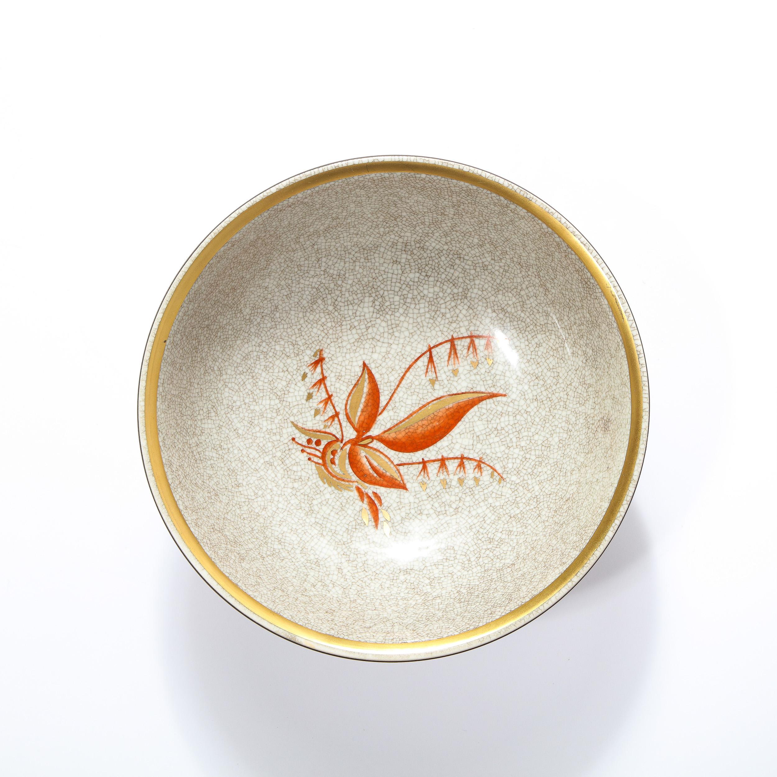 This elegant Mid-Century Modern decorative bowl/ dish was realized by the illustrious maker Royal Copenhagen in Denmark circa 1960. It features a concanve form with a cracqueleur pattern imprinted on the skein of its ceramic body. The top of the
