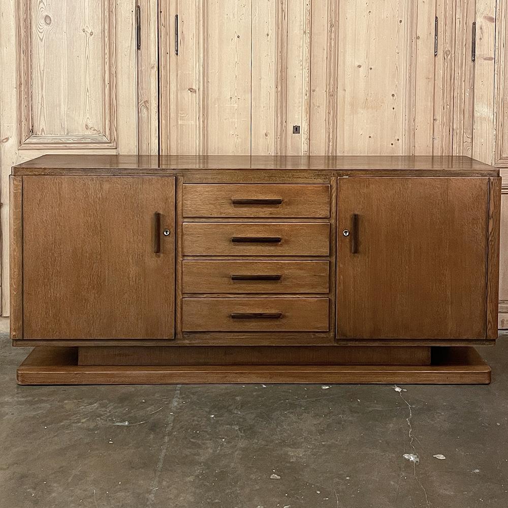 Mid-Century Modern credenza ~ Buffet will make the ideal choice for the contemporary and casual decors alike! Fashioned with a tailored rectilinear style, it features two spacious cabinets with interior shelves flanking a center section comprised of