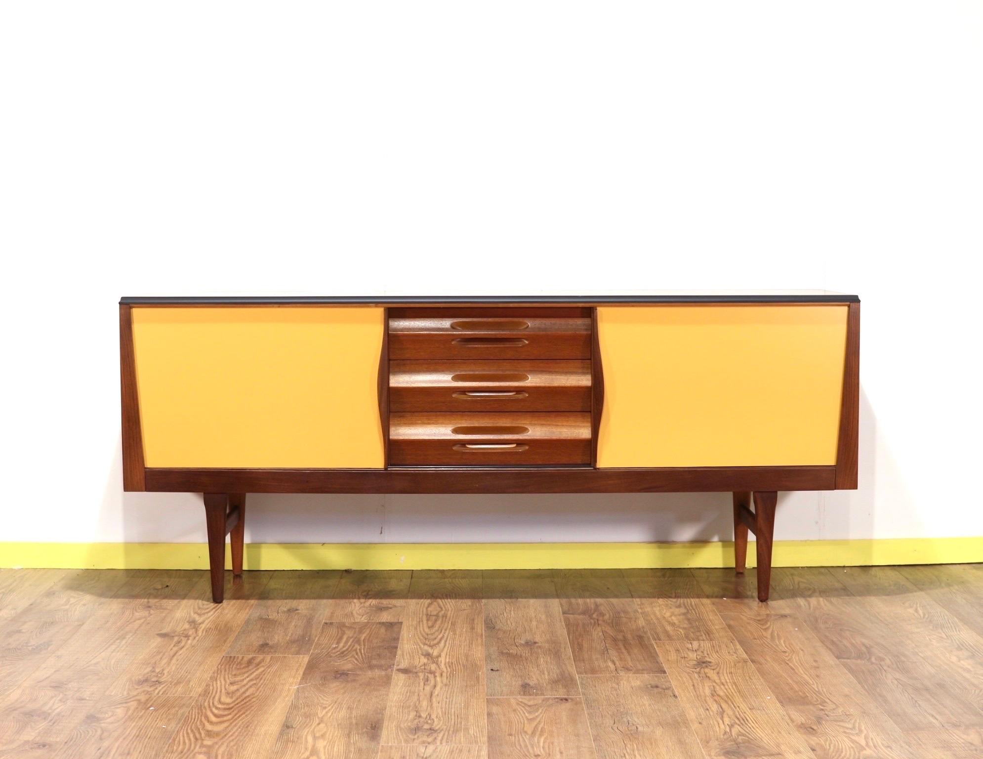 This unusal but beautiful credenza by British cabinet maker Elliots of Newbury is a stunning stand out piece that would look fabulous in and space. The yellow painted doors and black outer cabinet set this apart from the rest.