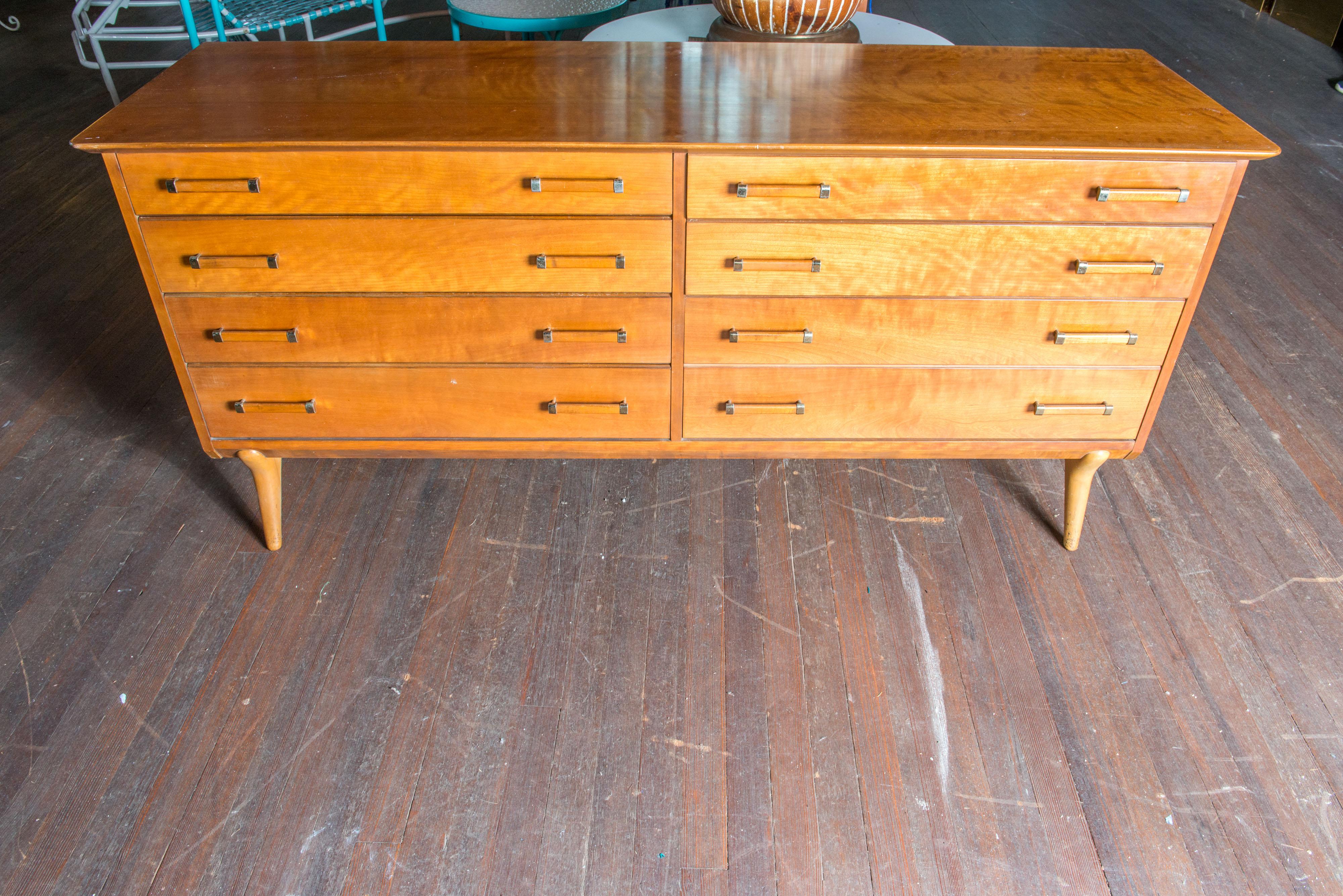 Mid-Century Modern credenza or chest of drawers by Renzo Rutili for Johnson Furniture Company. Solid wood, eight dovetailed drawers with brass trimmed wood pulls. Exceptionally good original condition. Timeless style.