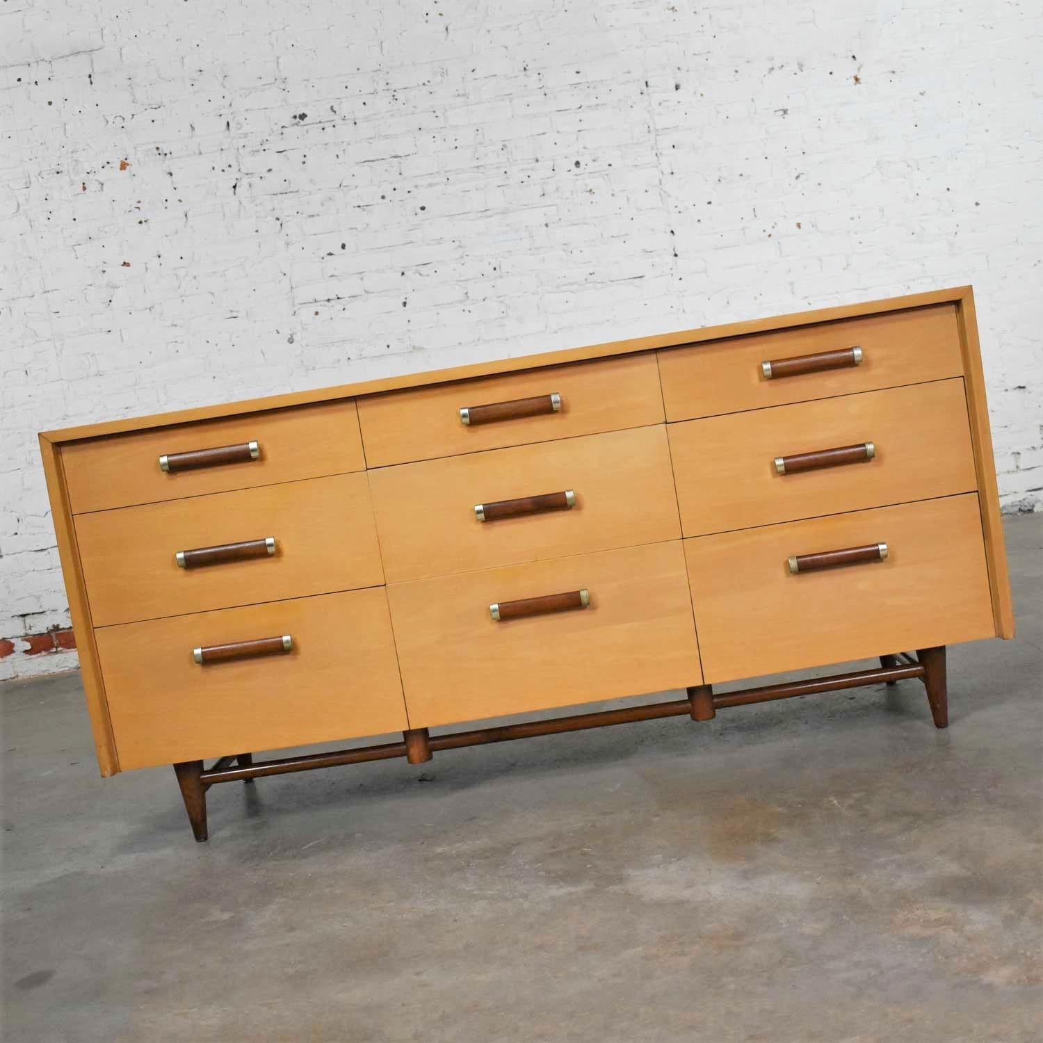 Handsome Mid-Century Modern nine-drawer dresser or credenza designed by Merton Gershun for his Urban Suburban line for American of Martinsville. It is in wonderful vintage condition. We have restored the cabinet top but there is still a nice age