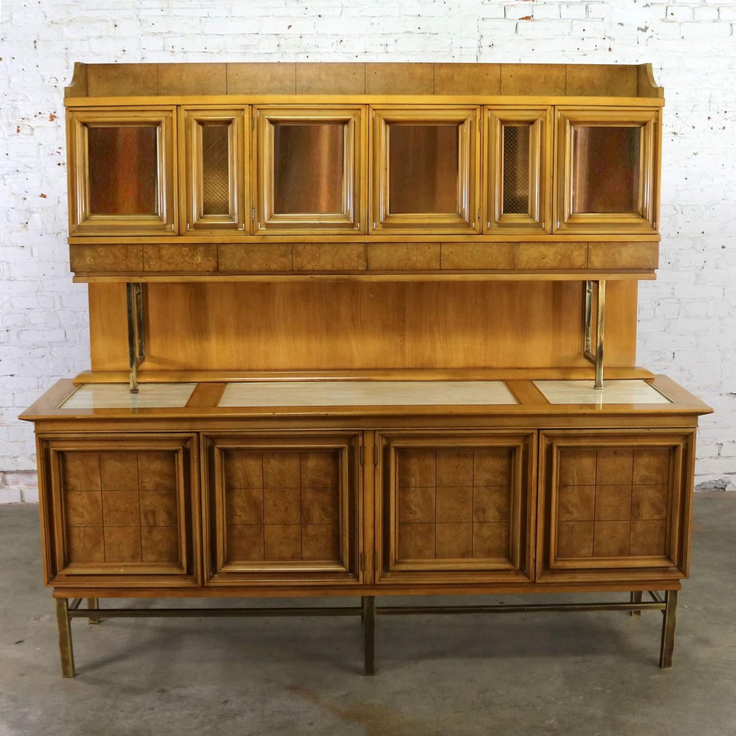 Handsome credenza with hutch top attributed to the J. L. Metz Furniture Company from their Contempora line. Made of weathered cherry and brass with travertine top inserts. It is in fabulous vintage condition with purposeful patina on the brass and
