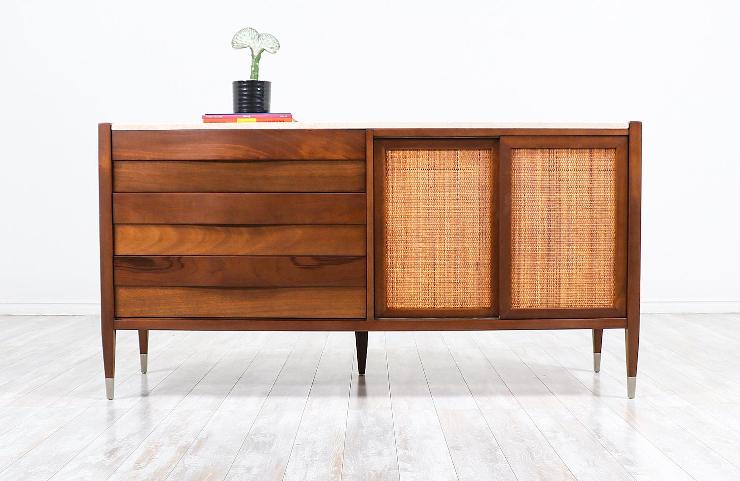 Mid-Century Modern credenza with travertine top and cane doors by American of Martinsville.