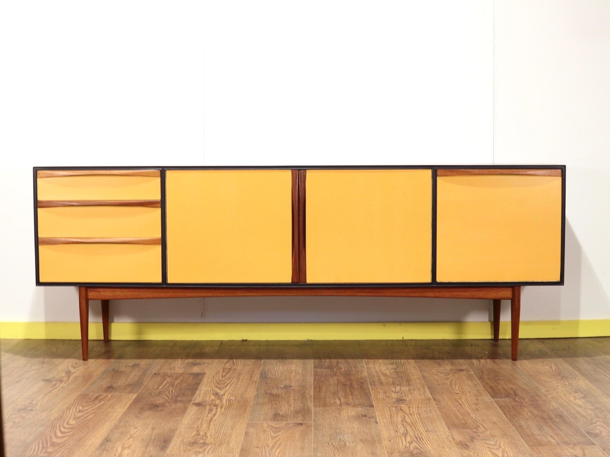 This truly stunnng sideboard is a real head turner. The credenza is made by A.H Mcintosh of Scotland and has some fantastic design. The crednza is not in its original colour but has been painted in fabulous style that really showcases this piece.