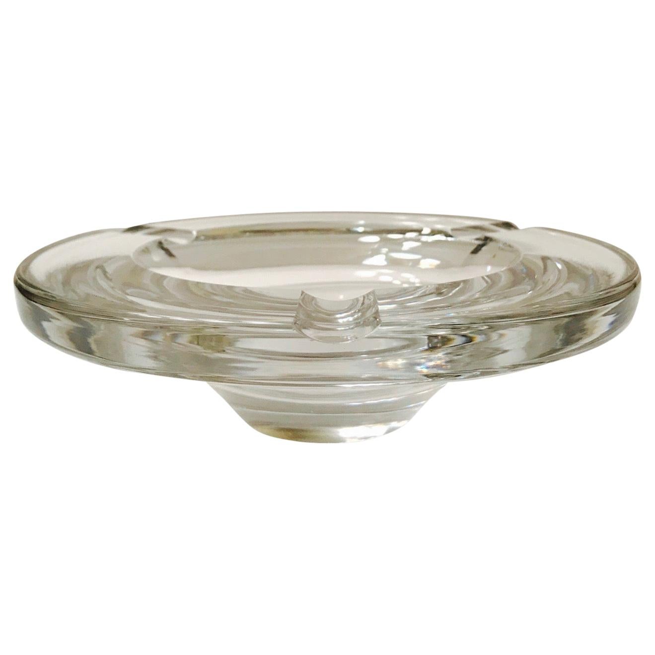 Gorgeous large and heavyweight cigar ashtray or decorative bowl in hand blown crystal. Ashtray has tapered streamline modernist design. Series # 71577. Signed Lindstrand for Kosta Boda.