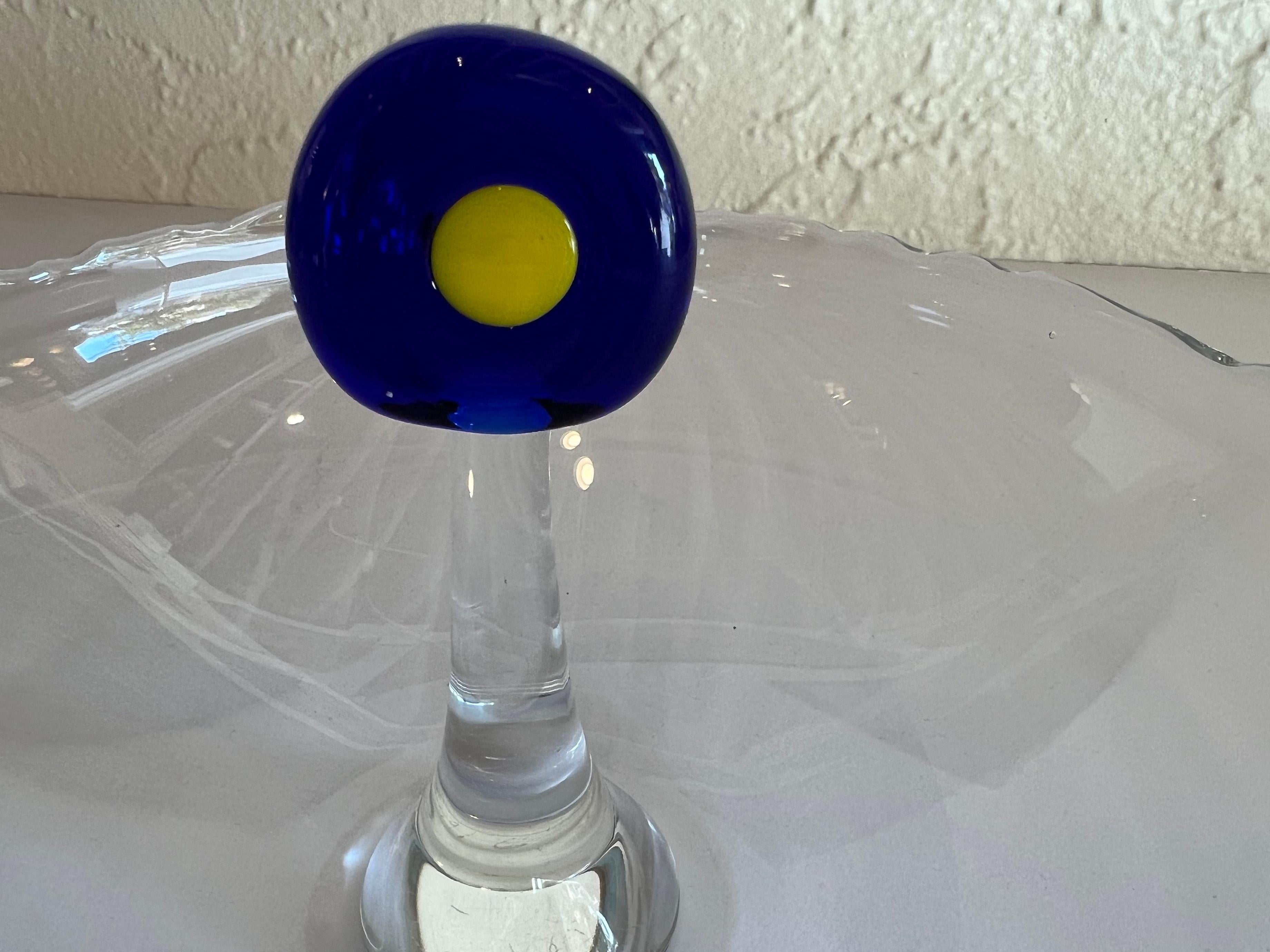Delicate Mid-Century Modern crystal bowl signed by the artist MP. The crystal has a central knob painted with a blue and yellow circle on the top part. 
The bowl is marked on the bottom with a 