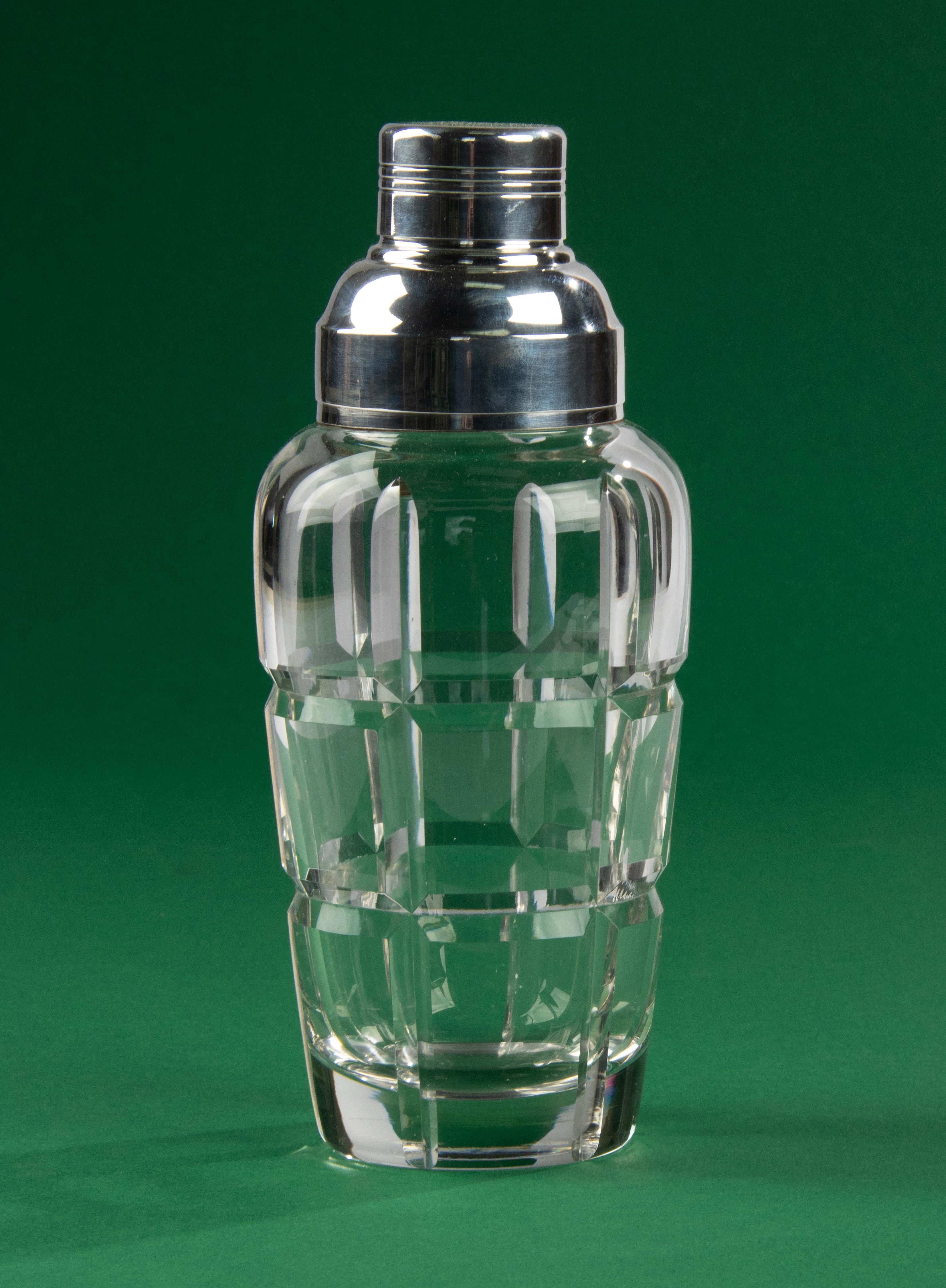Beautiful heavy quality crystal cut cocktail shaker. The cocktail shaker is cut all around with a deep cut checker pattern. The cap is silver plated and has a hallmark: Carme. The crystal and silver plating are in good condition, no wear on the