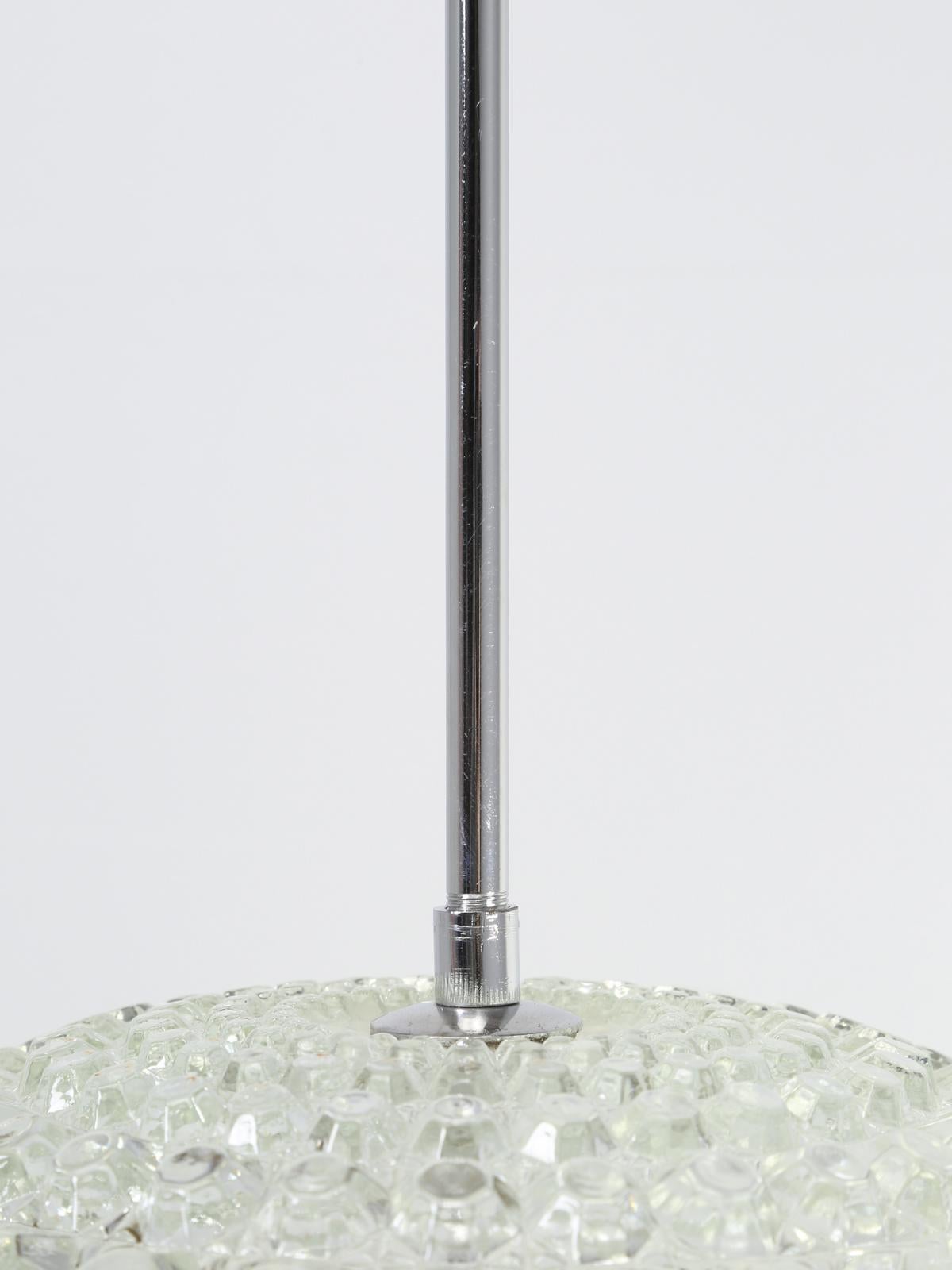 Vintage Mid-Century Modern crystal orb pendant fixture that was produced in Argentina. The chandelier is in Fine working order and was removed from an interior designer's own home.


Height provided includes everything. The rod is 14.5