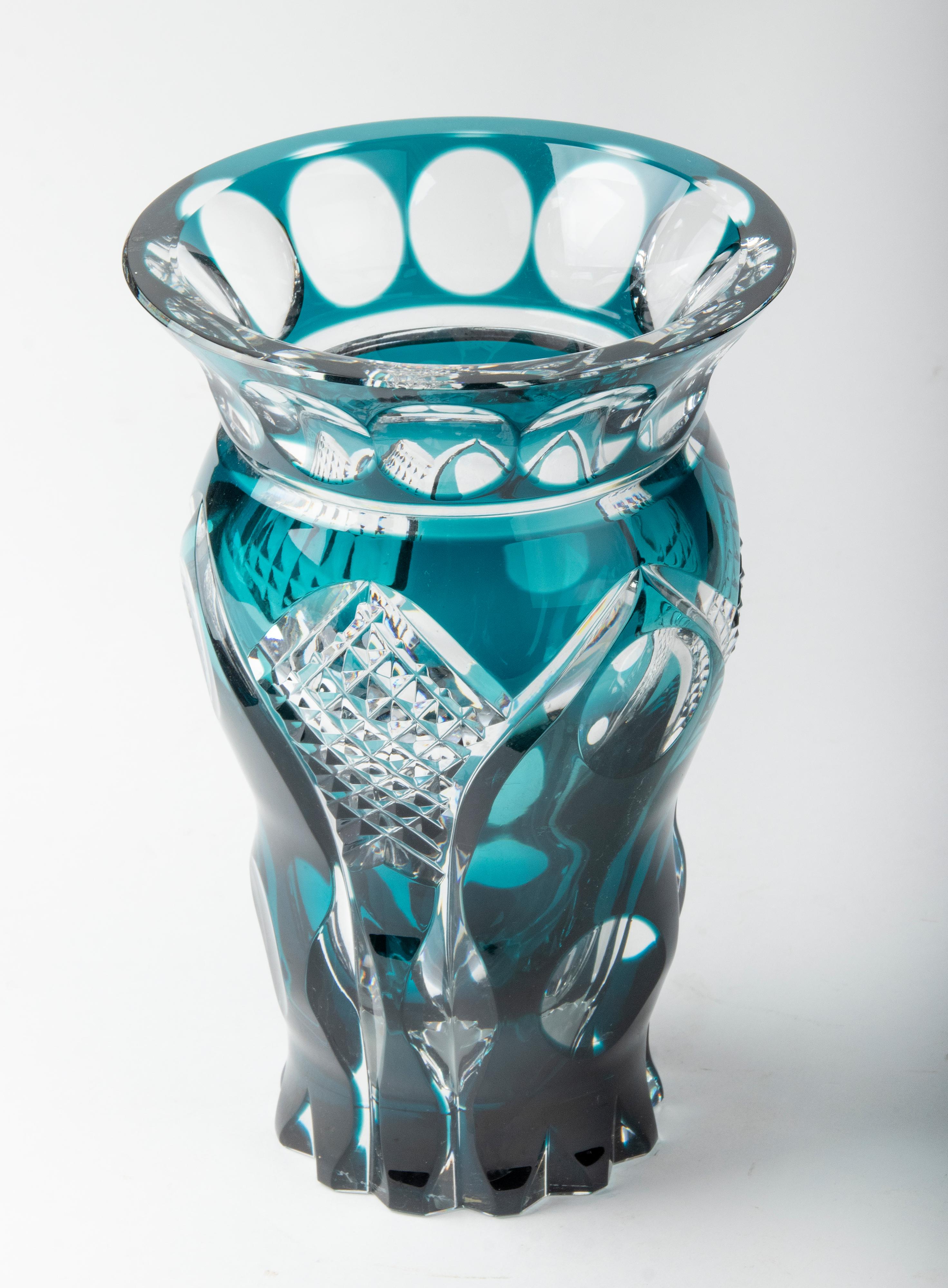 Large crystal vase from the Belgian brand Val Saint Lambert. The vase has a special deep blue color and beautiful carving work. The vase is signed on the bottom. Heavy quality. In good condition.
