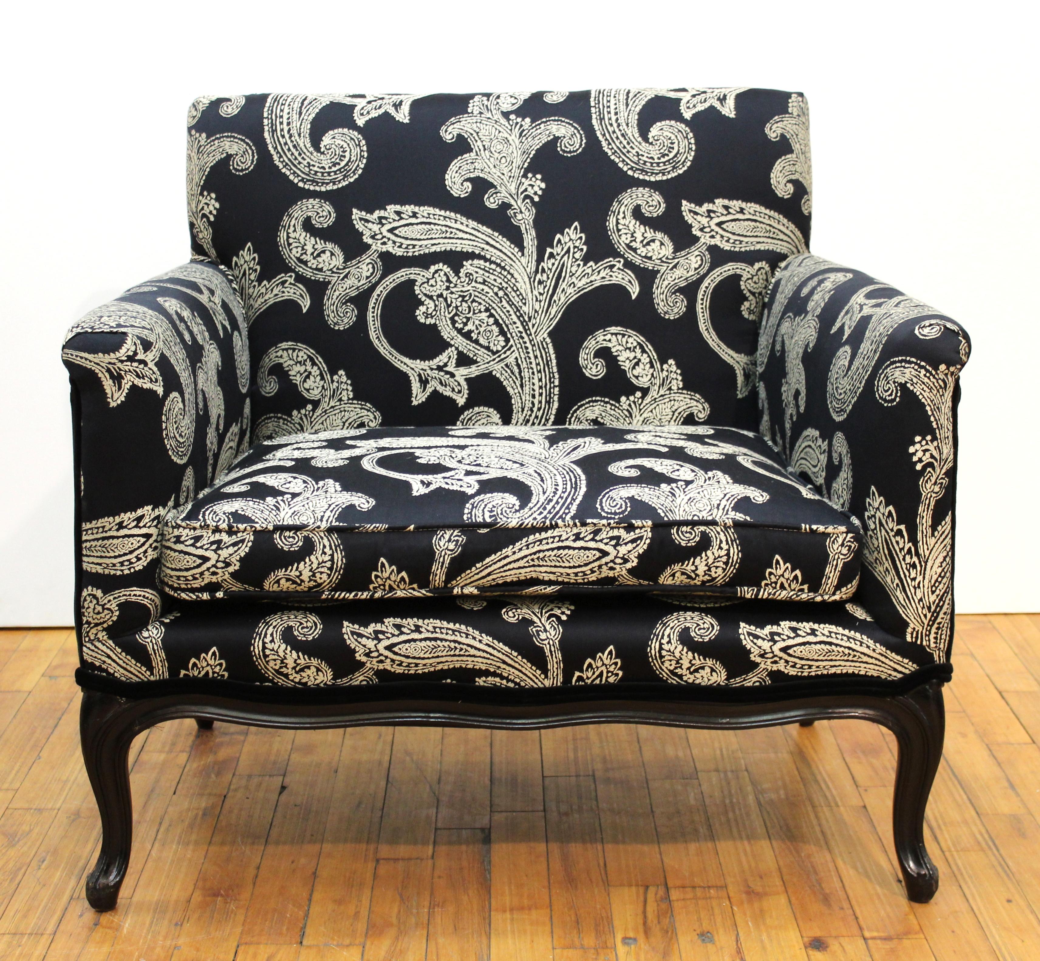 Mid-Century Modern pair of cube armchairs upholstered in black and cream Ralph Lauren paisley fabric. The chairs were made during the 1970s and the legs have been recently painted black. In great vintage condition.