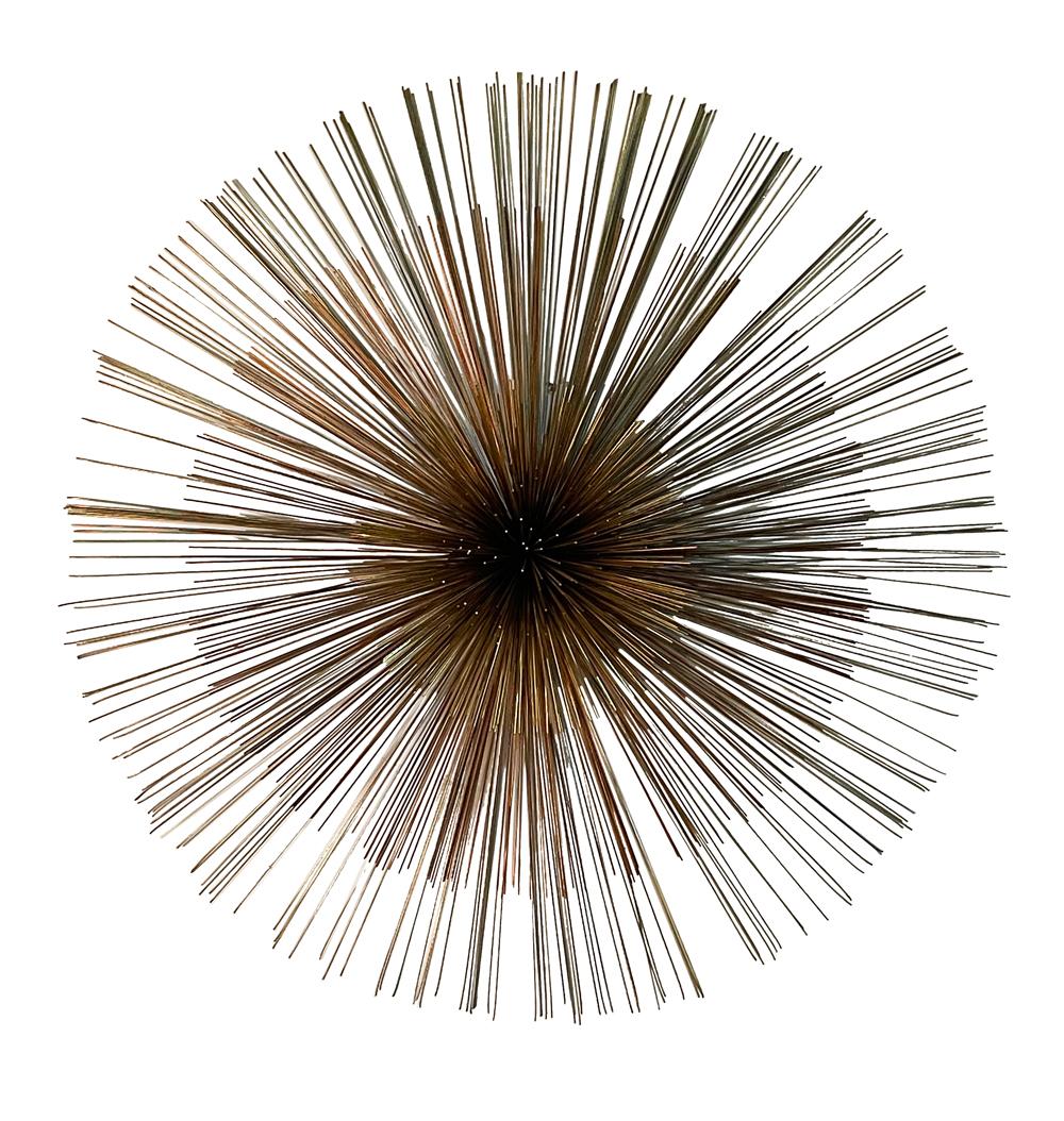 A large pom pom wall sculpture made by C. Jere in the 1980's. It consists of 3 metal design in brass, copper and steel. Very clean nice condition. Artist signed on back.