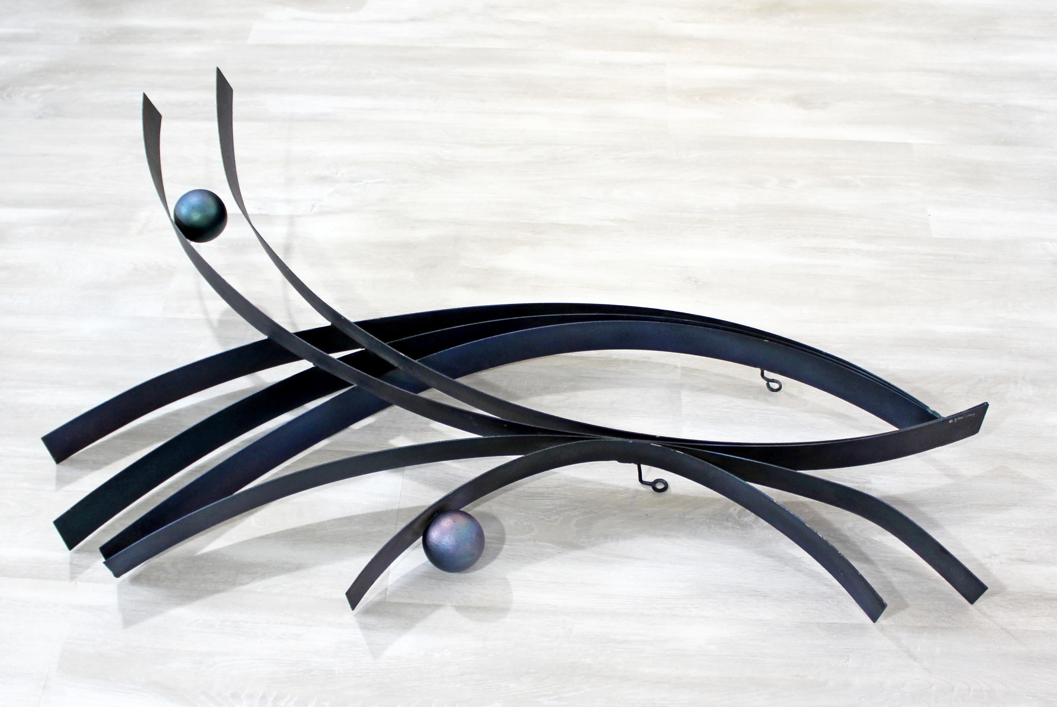 For your consideration is a gorgeous, abstract, black metal wall sculpture, with blue balls, signed Curtis Jere, dated 1977. In very good vintage condition. The dimensions are 27