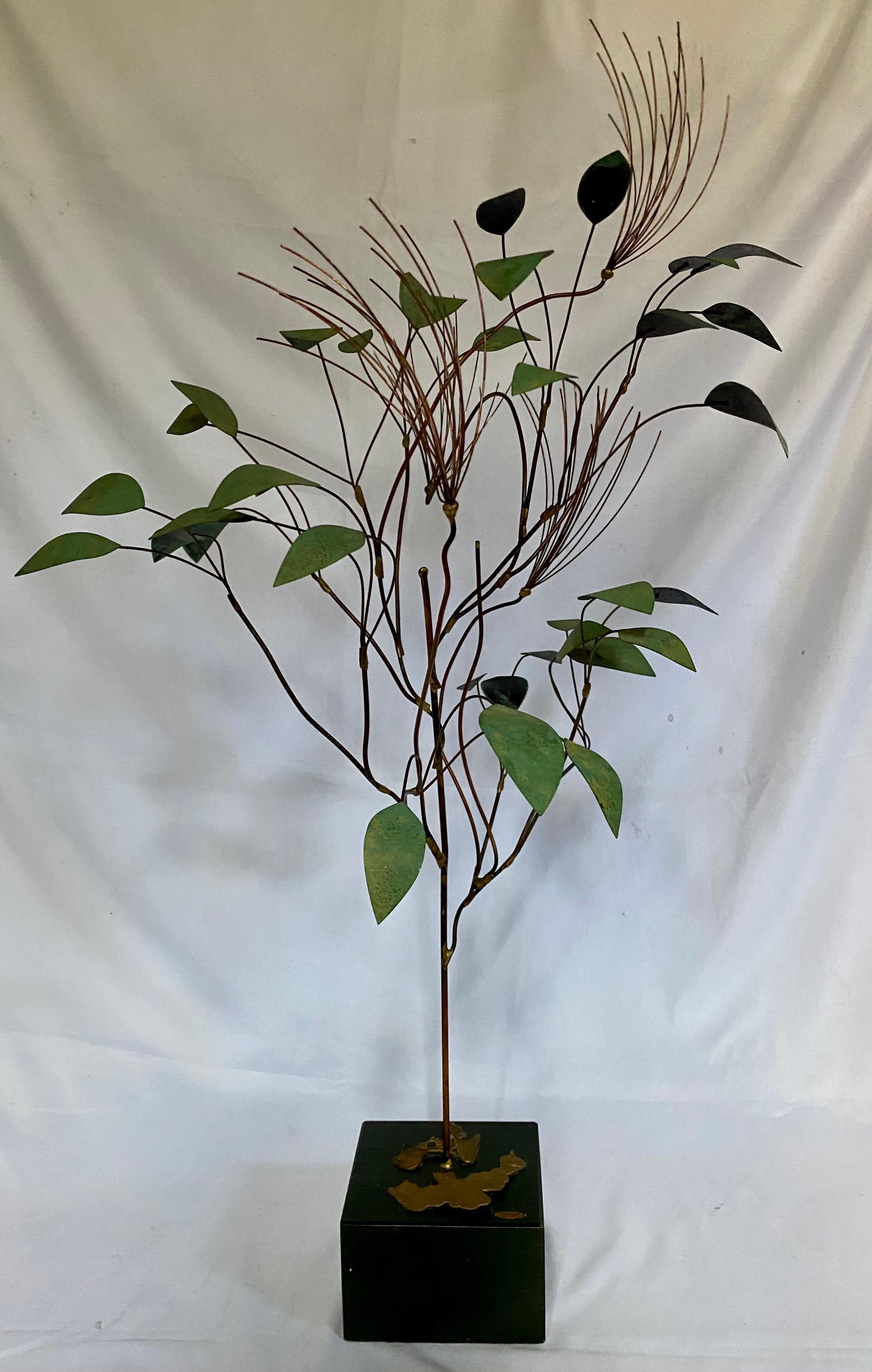 Mid-Century Modern metal tree sculpture by Curtis Jere. This Brutalist art sculpture features brass painted leaves with wire spray bursts and is mounted on a black wood base. Signed and date 1966.

Base measures 5.25 x 5.5 inches.