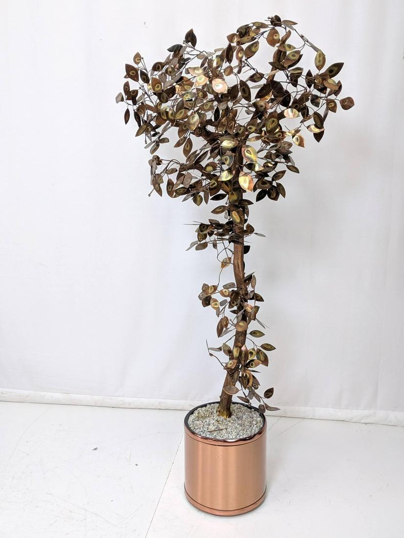 Attributed to Curtis Jere Brutalist welded copper tree floor sculpture. Torched copper leaves on copper painted natural wood stems. In a copper tone planter. Two compatible sculptures available. Dimensions: H 73 inches, W 42 inches, D 27.
