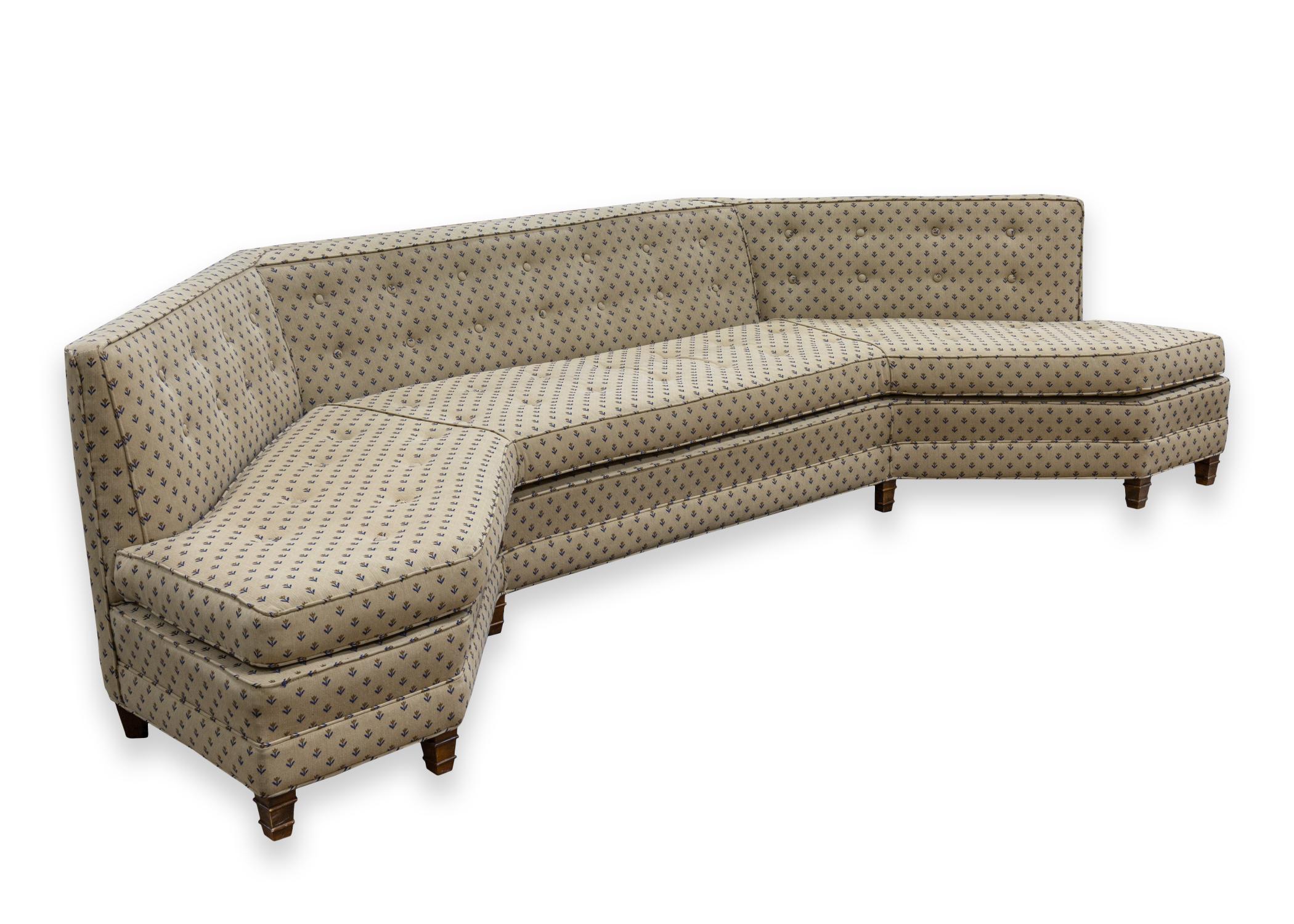 A curved sofa in the manner of Harvey Probber. A gorgeous mid century modern sofa piece with a unique curved shape and design. This piece is stunning with its combination of contemporary and traditional elements. This piece features a clean beige
