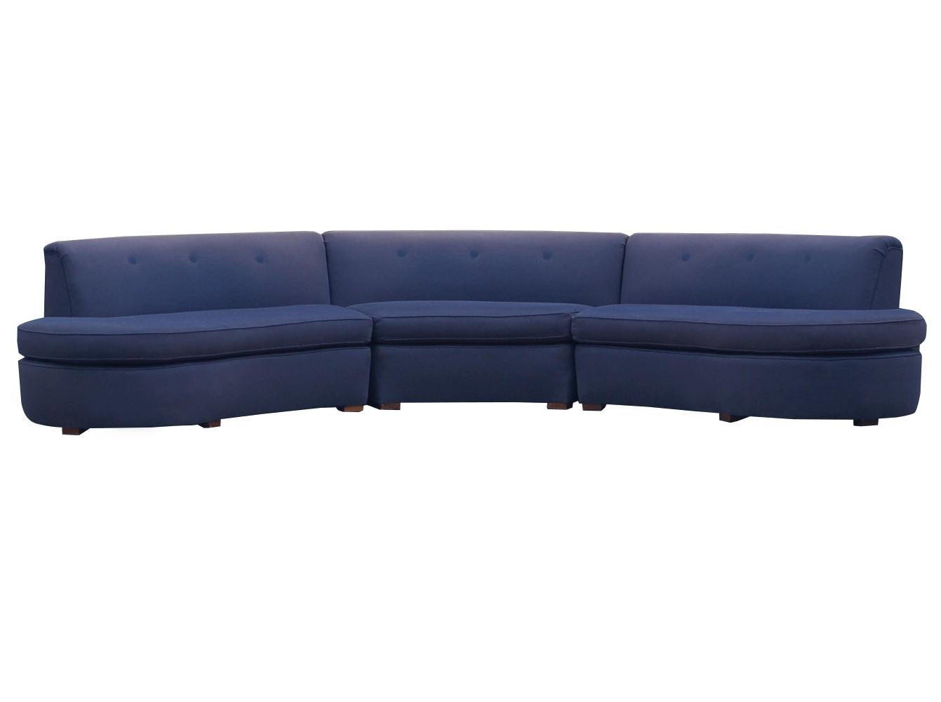 A solid well made sofa from the early 1960s. It features clean modern design lines, low backrest, and low profile solid wood feet.