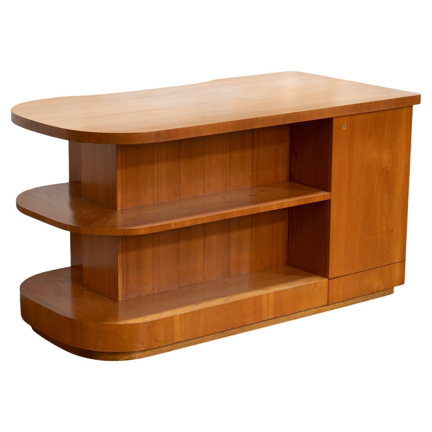 Art Moderne Swedish Elm Desk with open shelf, two cabinets, and a set of three drawer. This is a unique piece, with a curved organic shape and plenty of storage solutions. Display books and treasures on the exposed shelves and tuck files, papers,