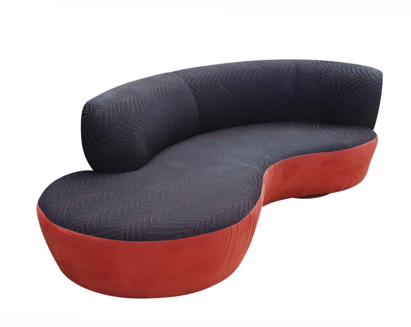 A sleek modern sofa designed by Weiman in the 1980s. It features a curved design, with circular platform bases, and original textured print upholstery. Needs recovering. Manufacture label.