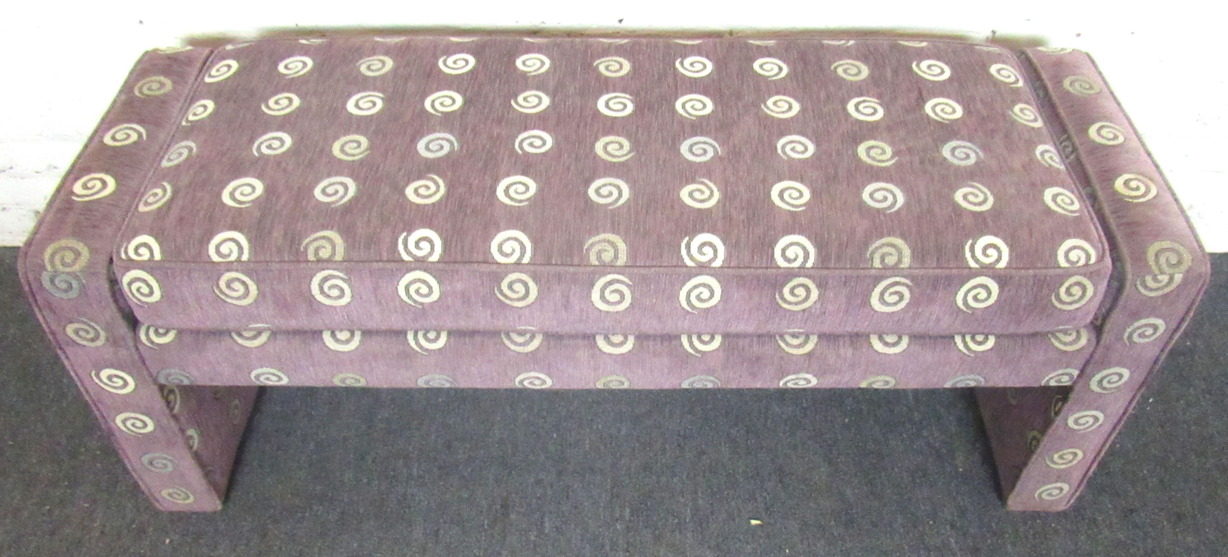 Unique vintage cushioned bench. Finished in a beautiful subtle purple upholstery with gold spiral accents. This bench would be perfect in a living room, entryway, or at the foot of your bed.

Please confirm item location (NY or NJ).